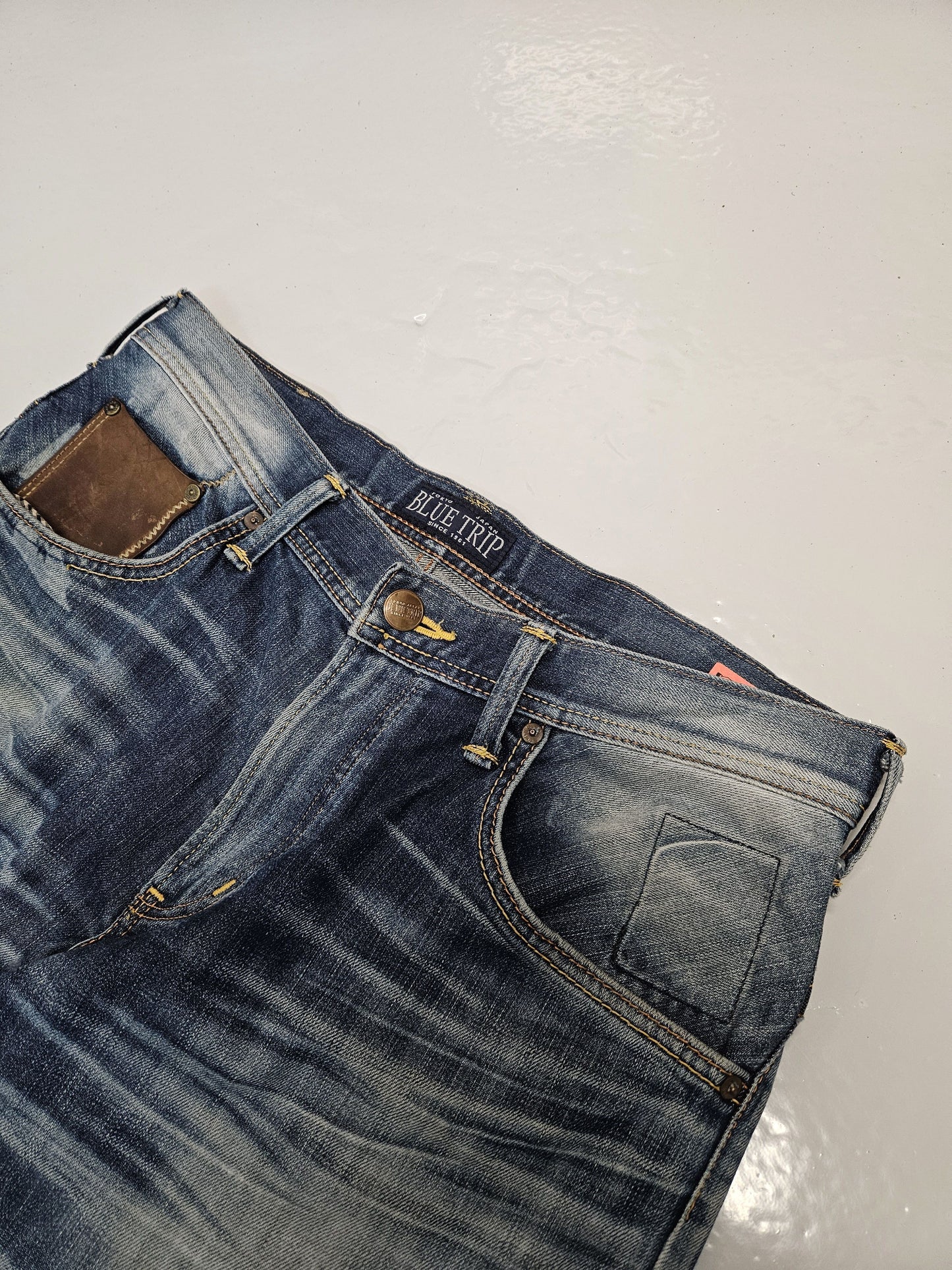 Edwin blue trip distressed washed bootcut denim