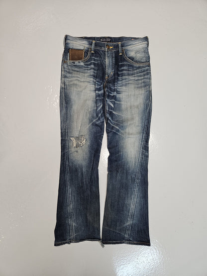 Edwin blue trip distressed washed bootcut denim