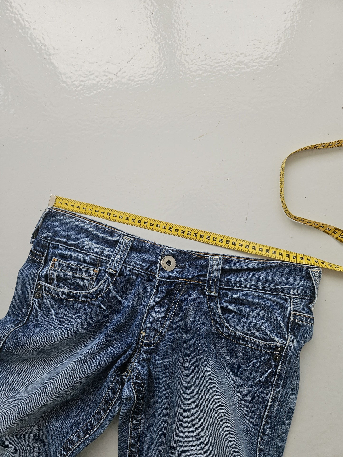 Vintage distressed bootcut low waisted denim