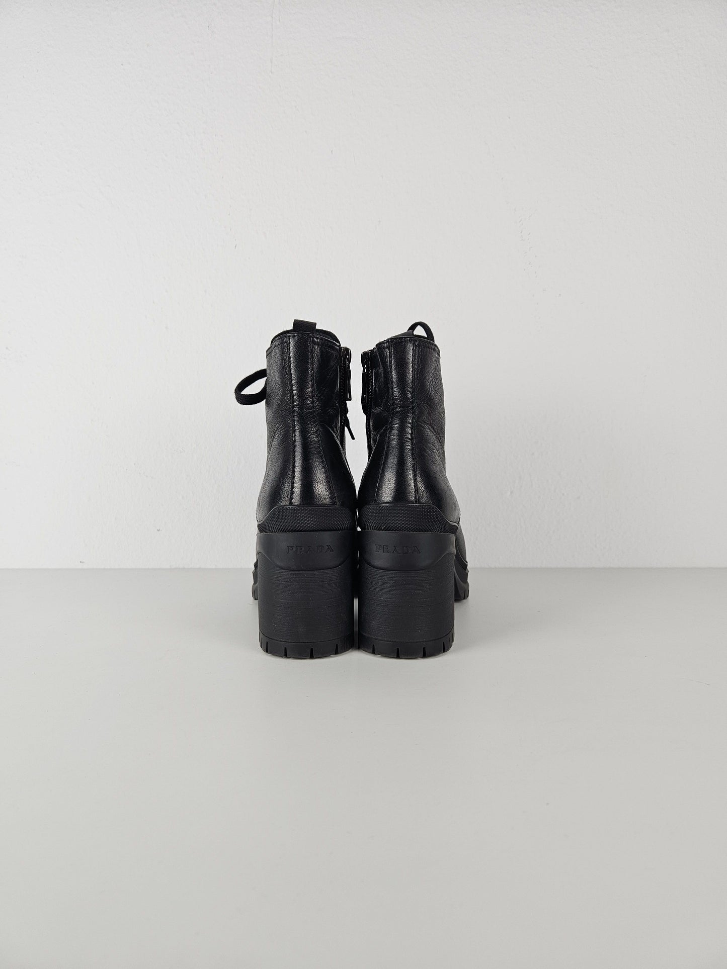 Prada lace up block heel notched sole ankle boots