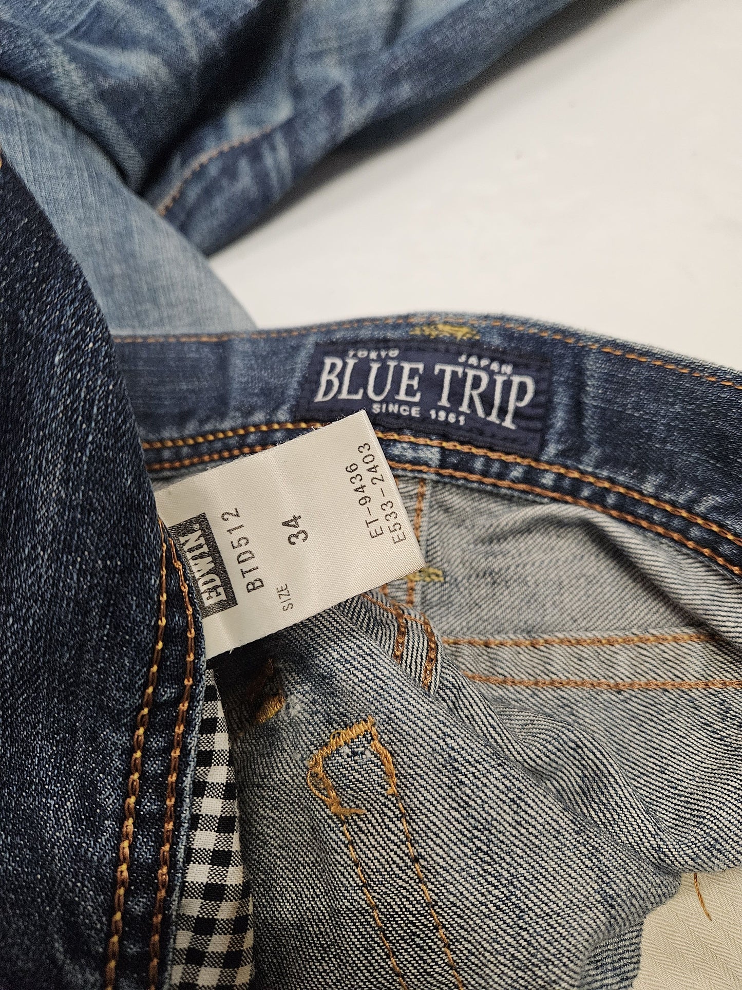 Edwin blue trip distressed washed bootcut denim