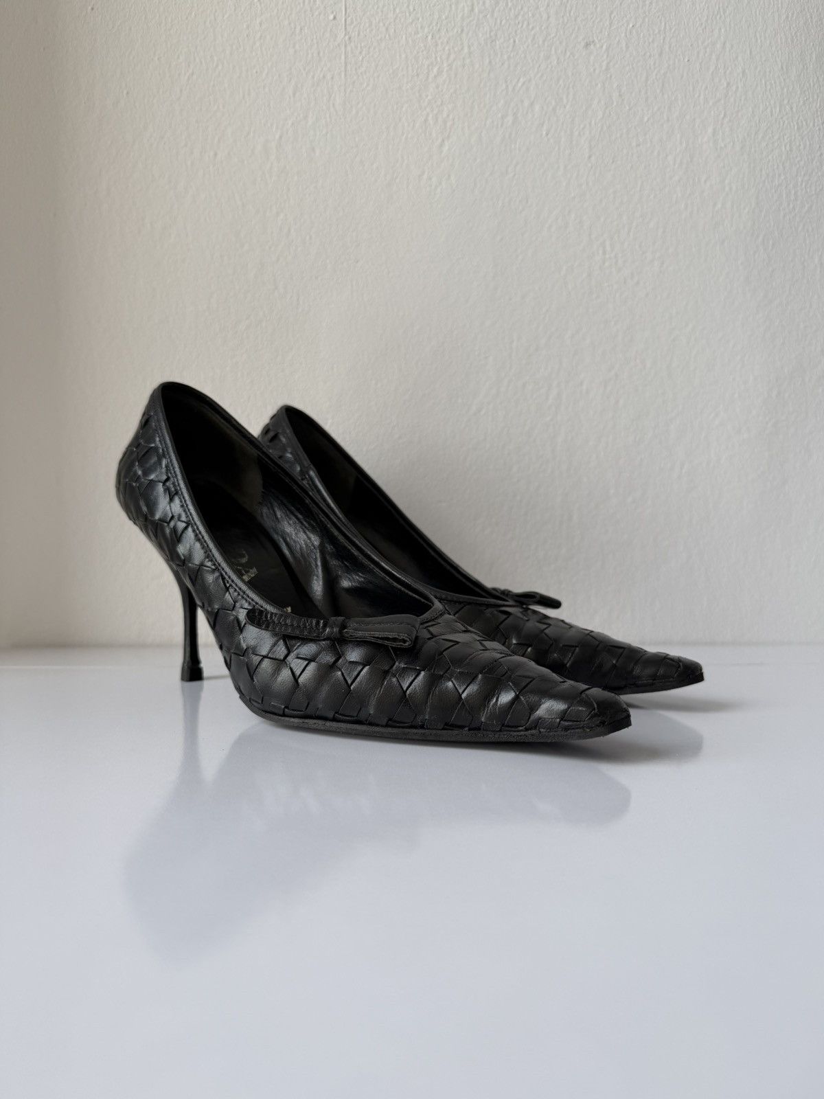 Prada woven leather long toe pumps with bow