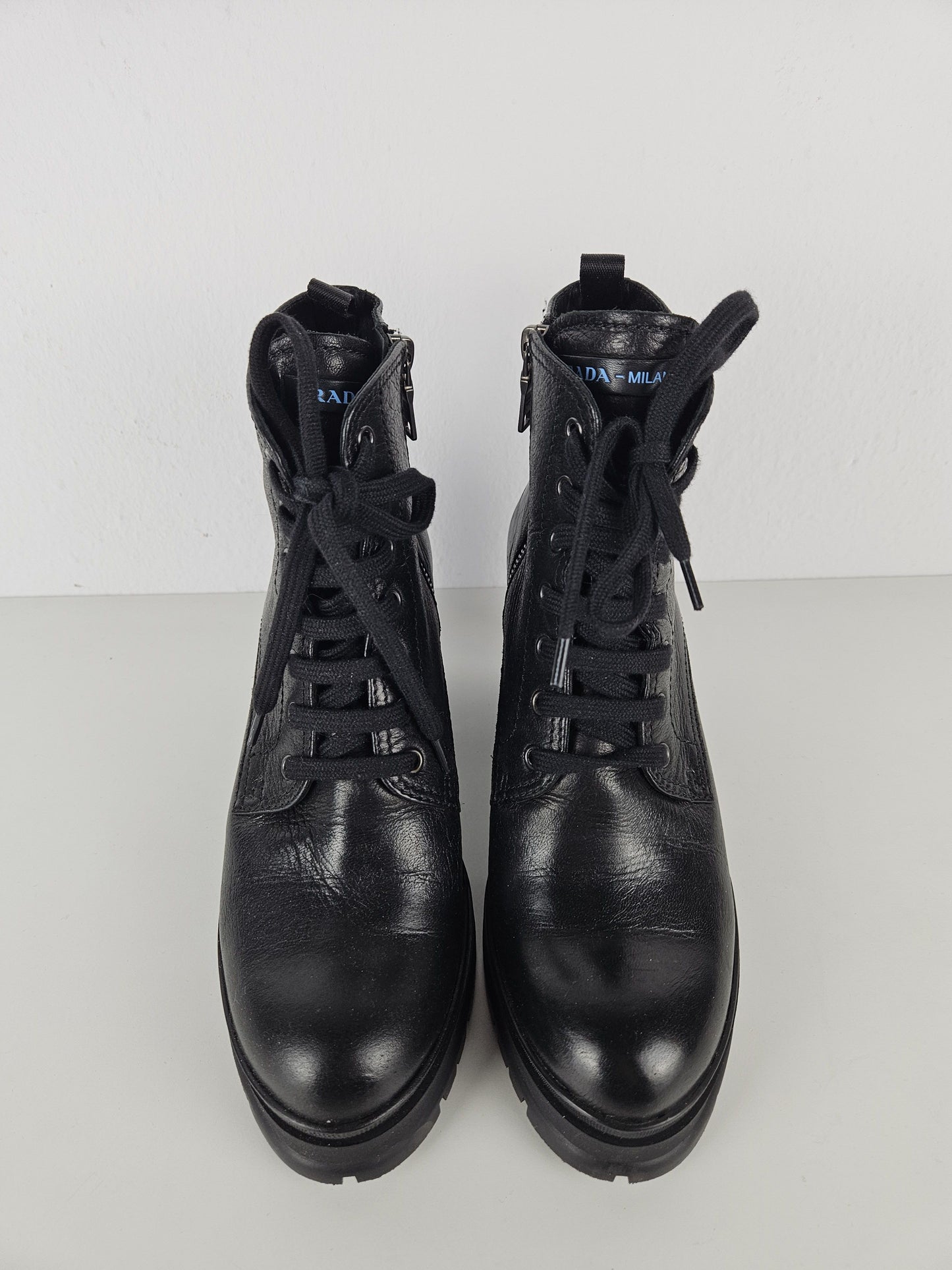 Prada lace up block heel notched sole ankle boots