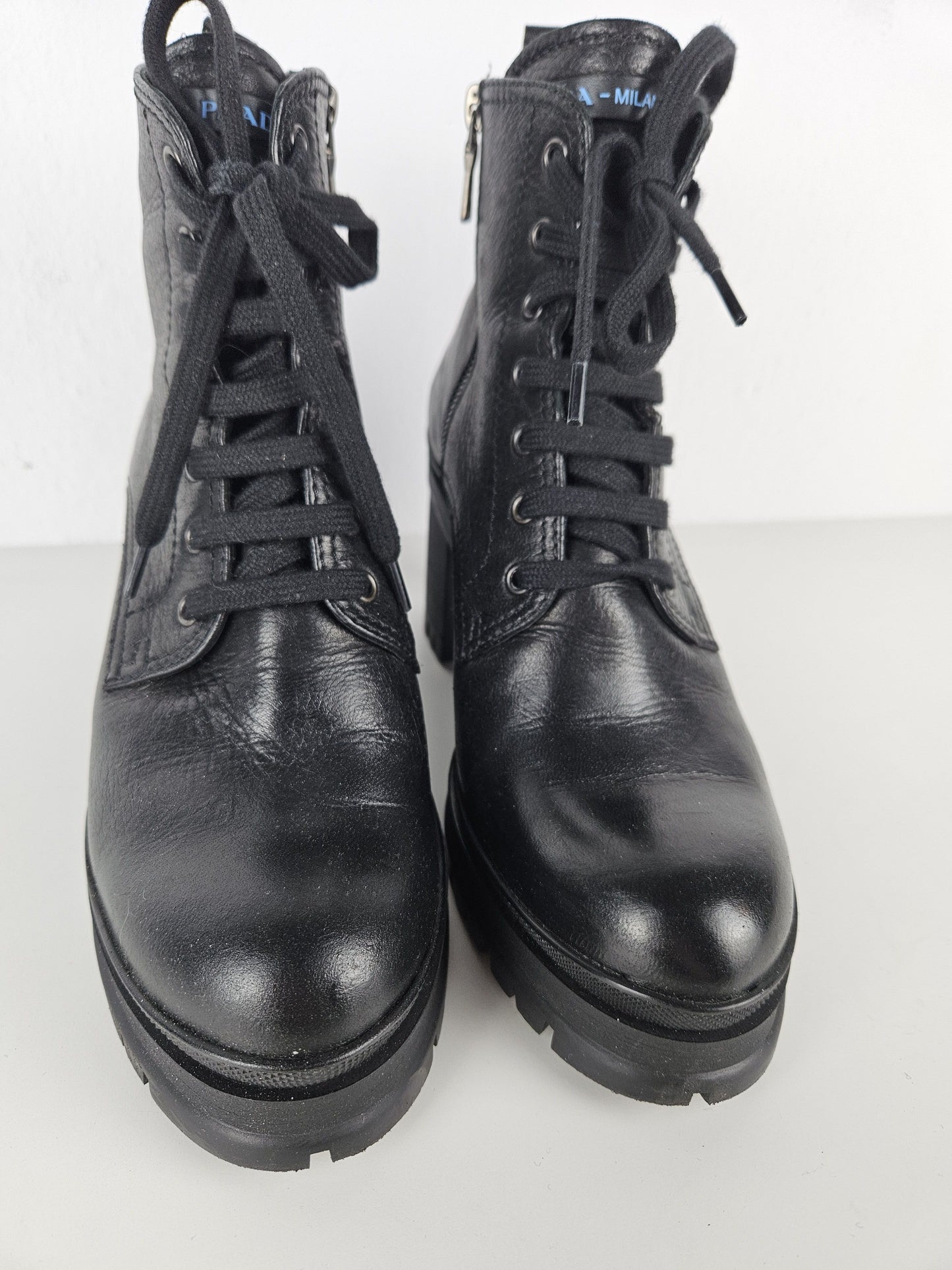 Prada lace up block heel notched sole ankle boots