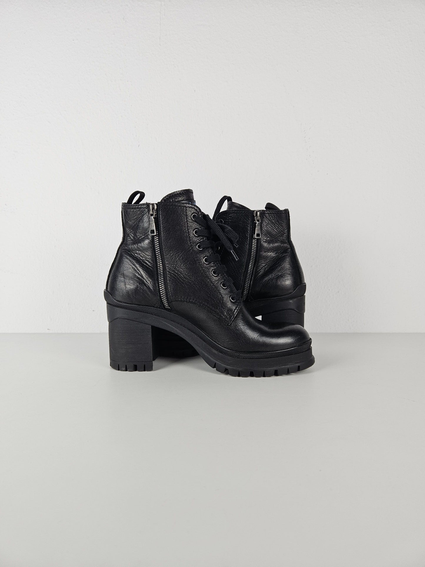 Prada lace up block heel notched sole ankle boots