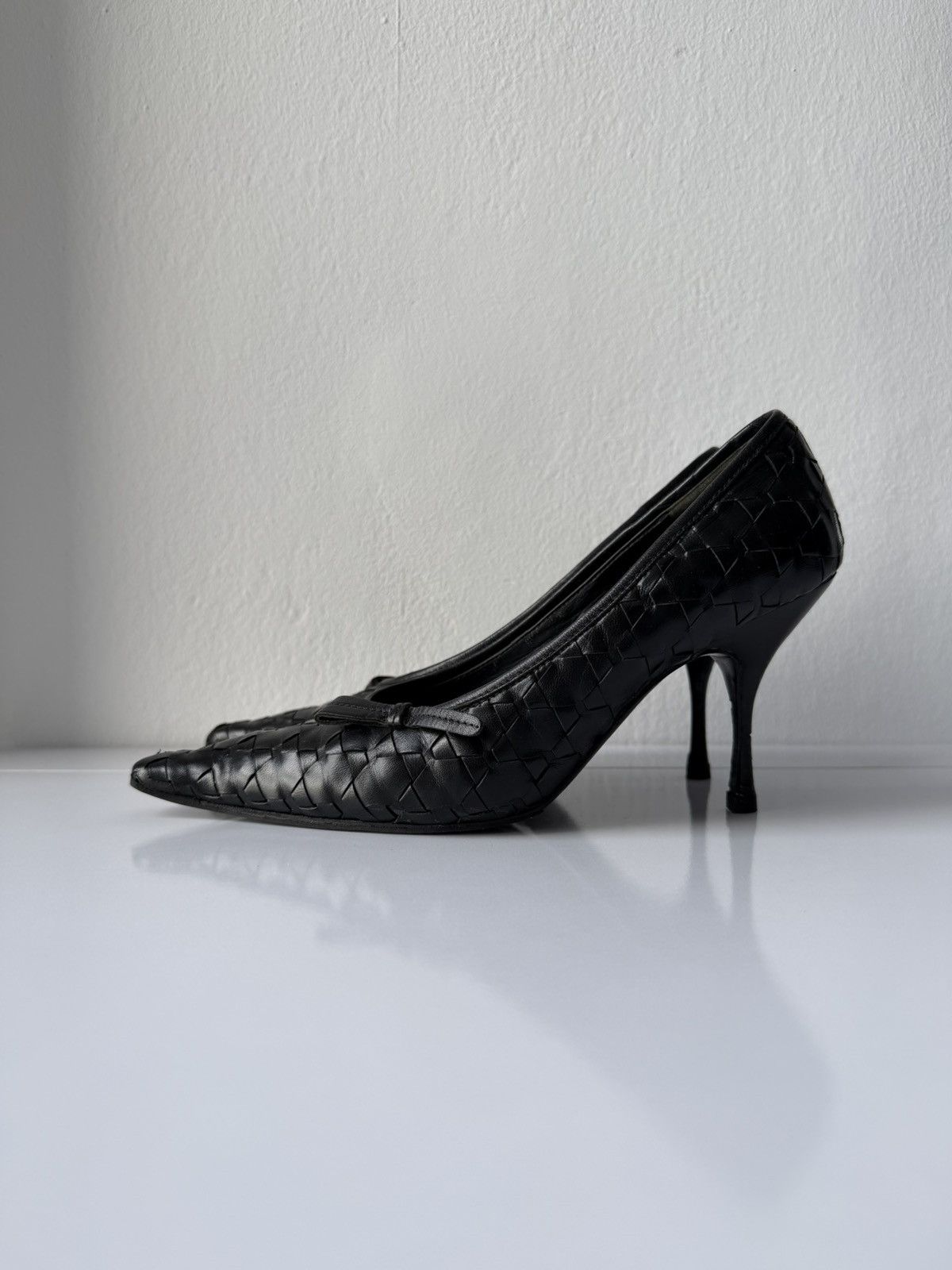 Prada woven leather long toe pumps with bow