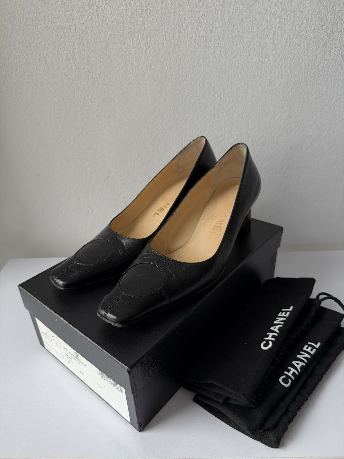 AW2001 Chanel embossed logo long toe leather pumps