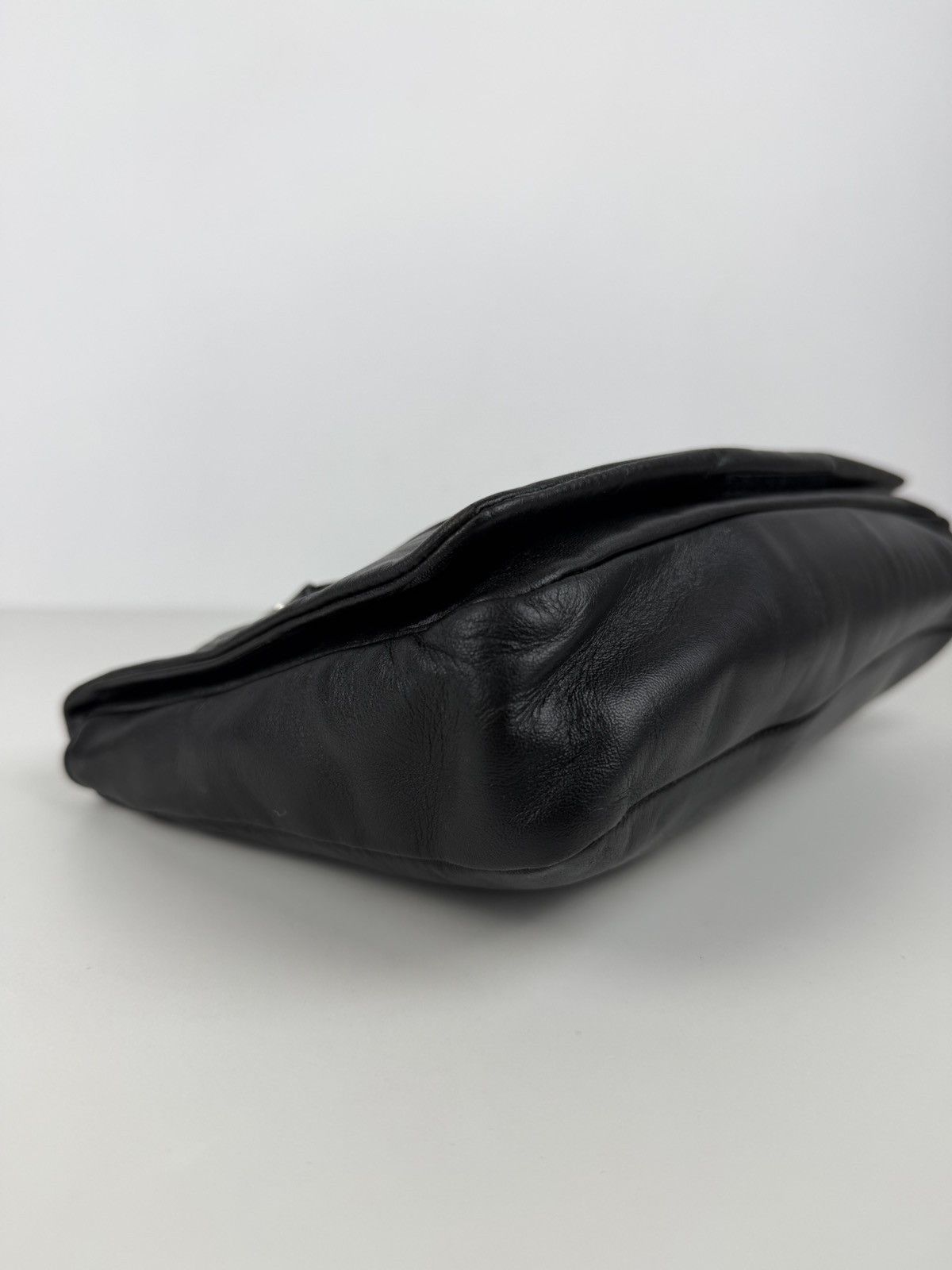Vintage Prada embossed logo leather shoulder bag