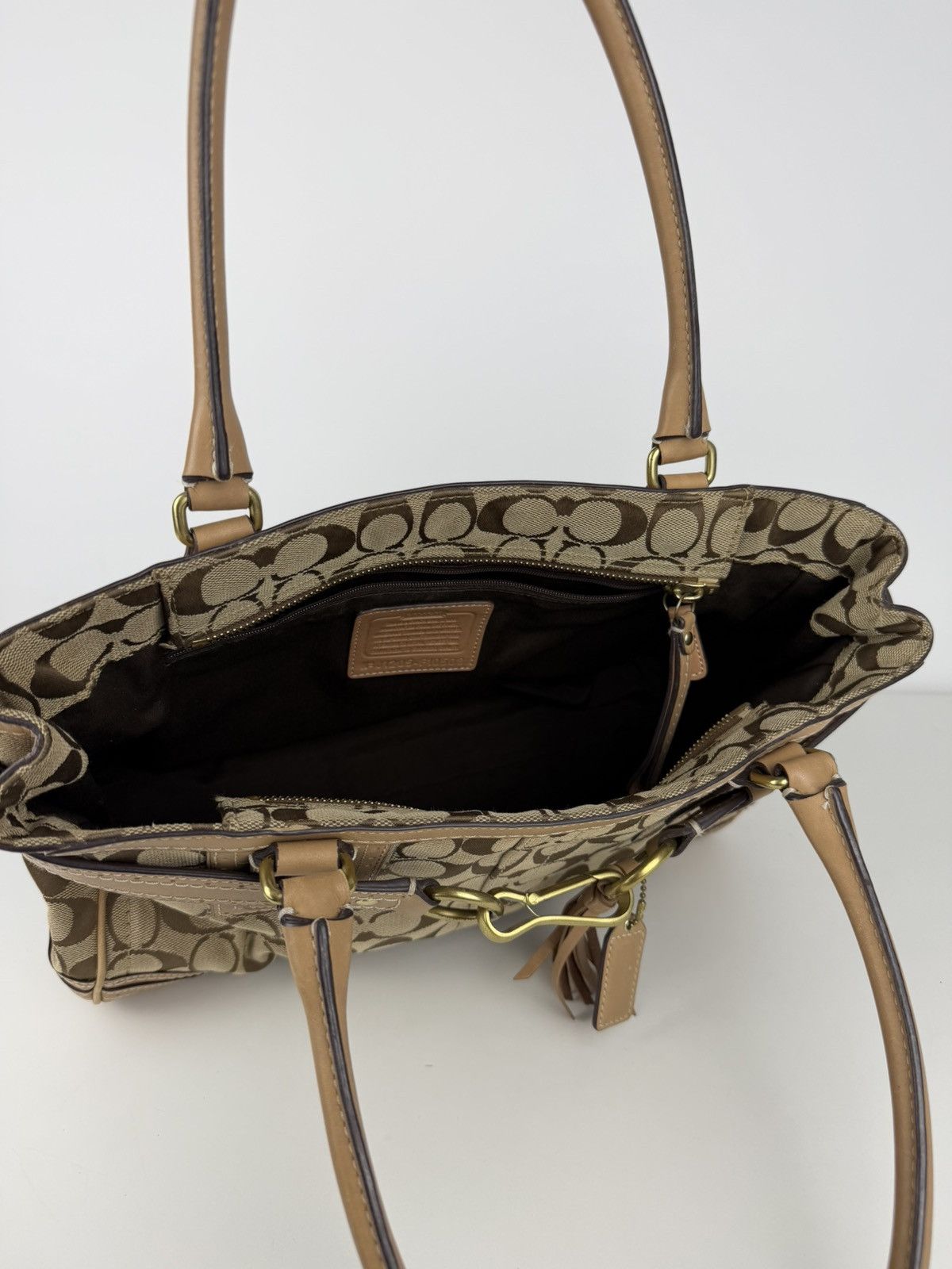 Coach signature leather canvas tassel tote bag