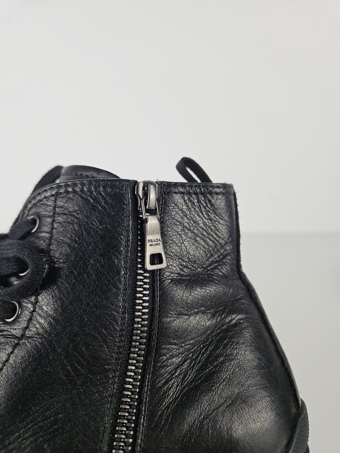 Prada lace up block heel notched sole ankle boots