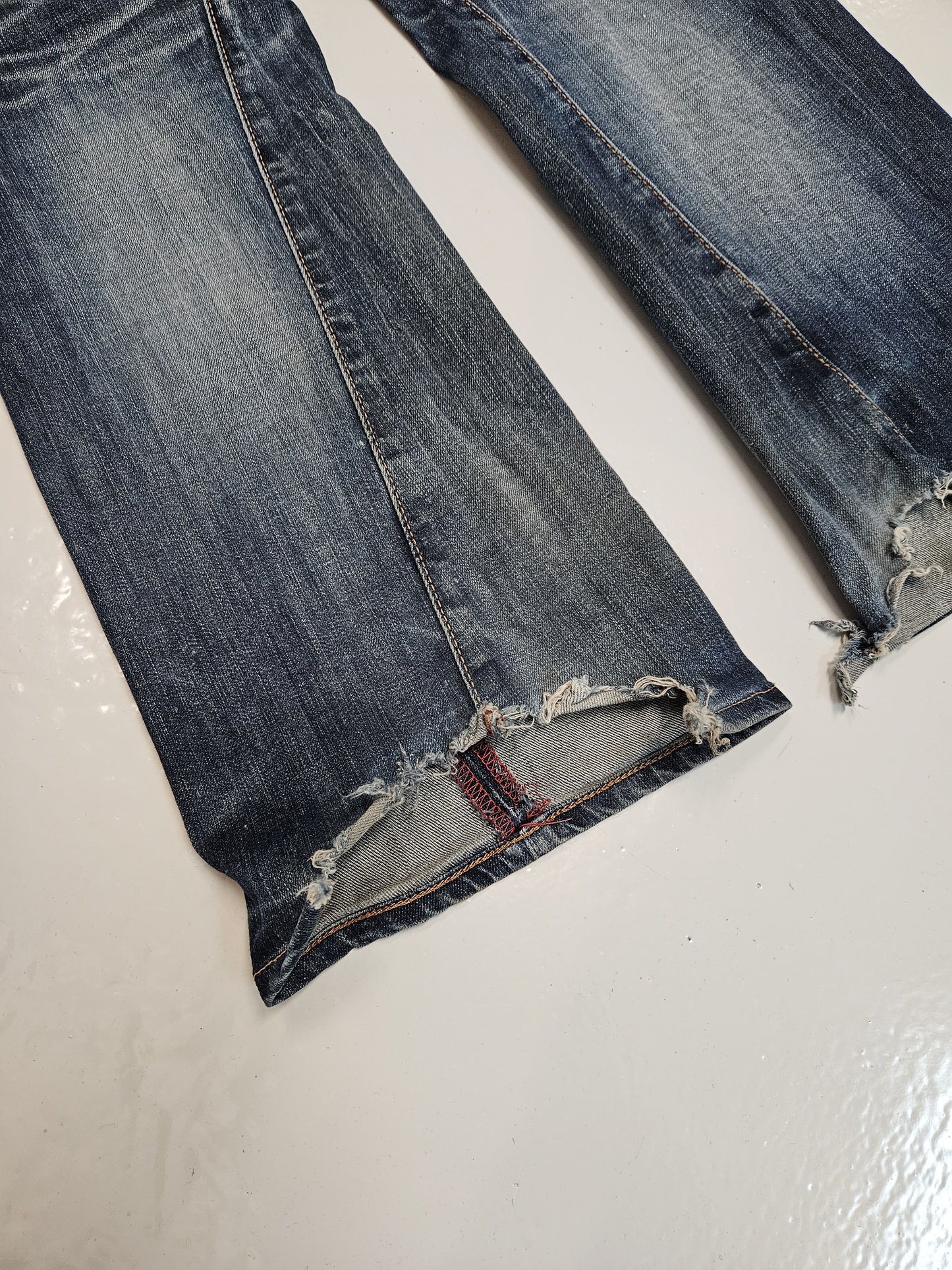 Edwin blue trip distressed washed bootcut denim