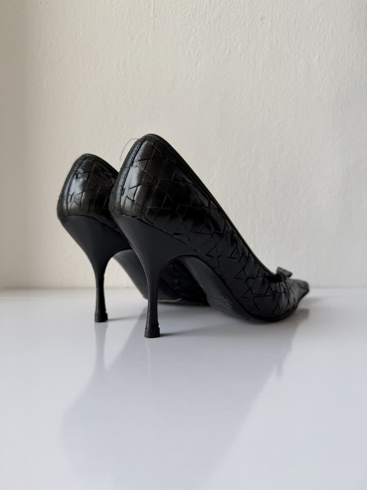 Prada woven leather long toe pumps with bow