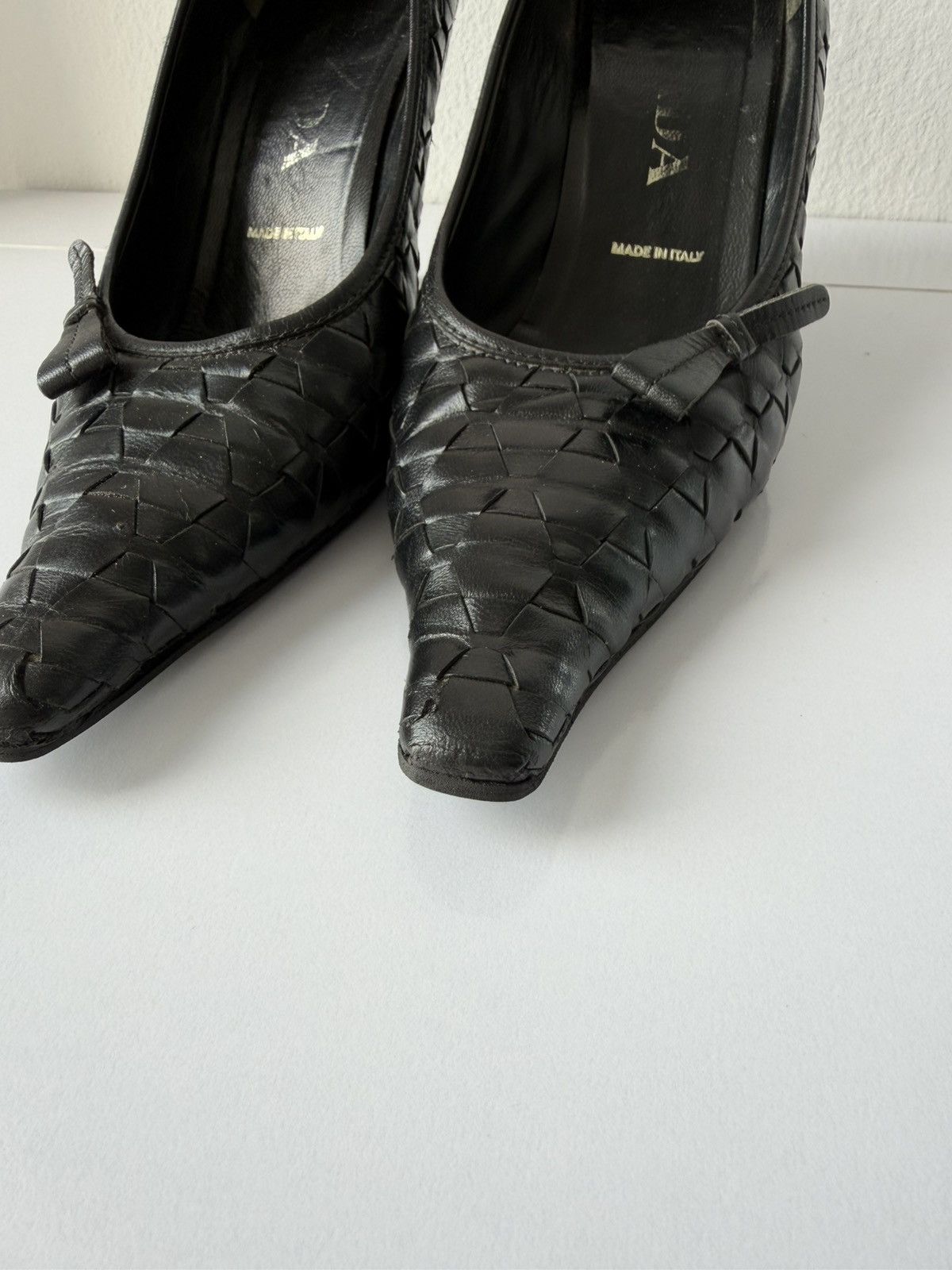 Prada woven leather long toe pumps with bow