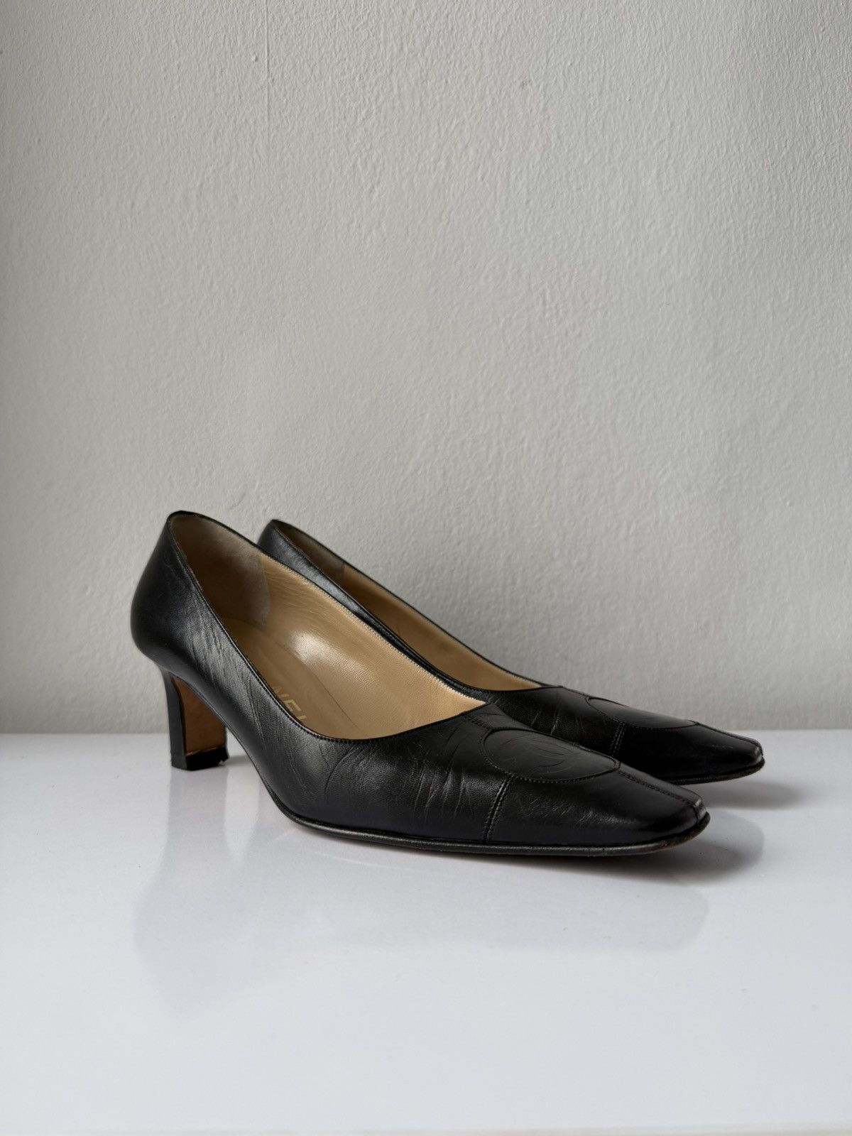 AW2001 Chanel embossed logo long toe leather pumps