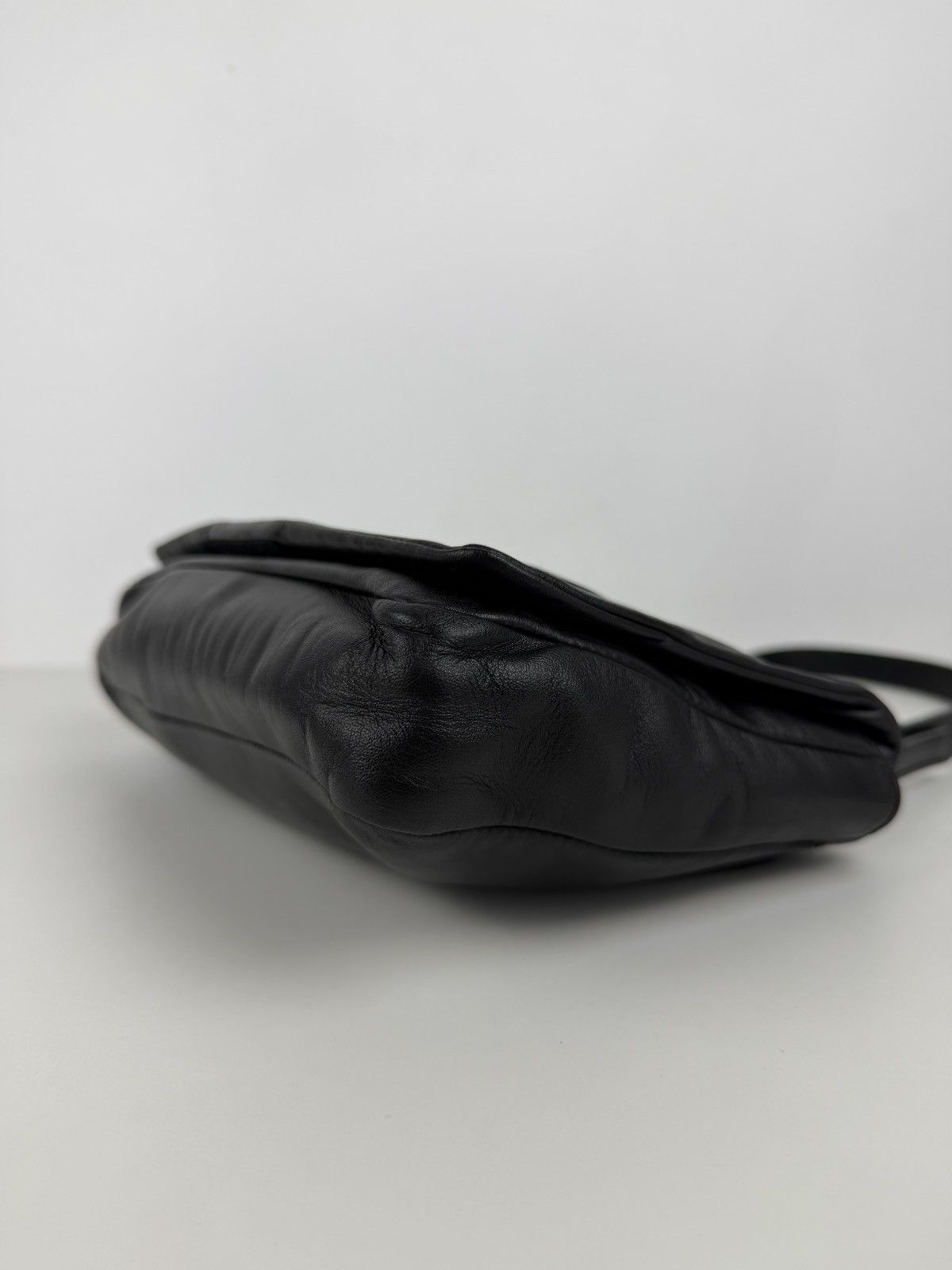 Vintage Prada embossed logo leather shoulder bag