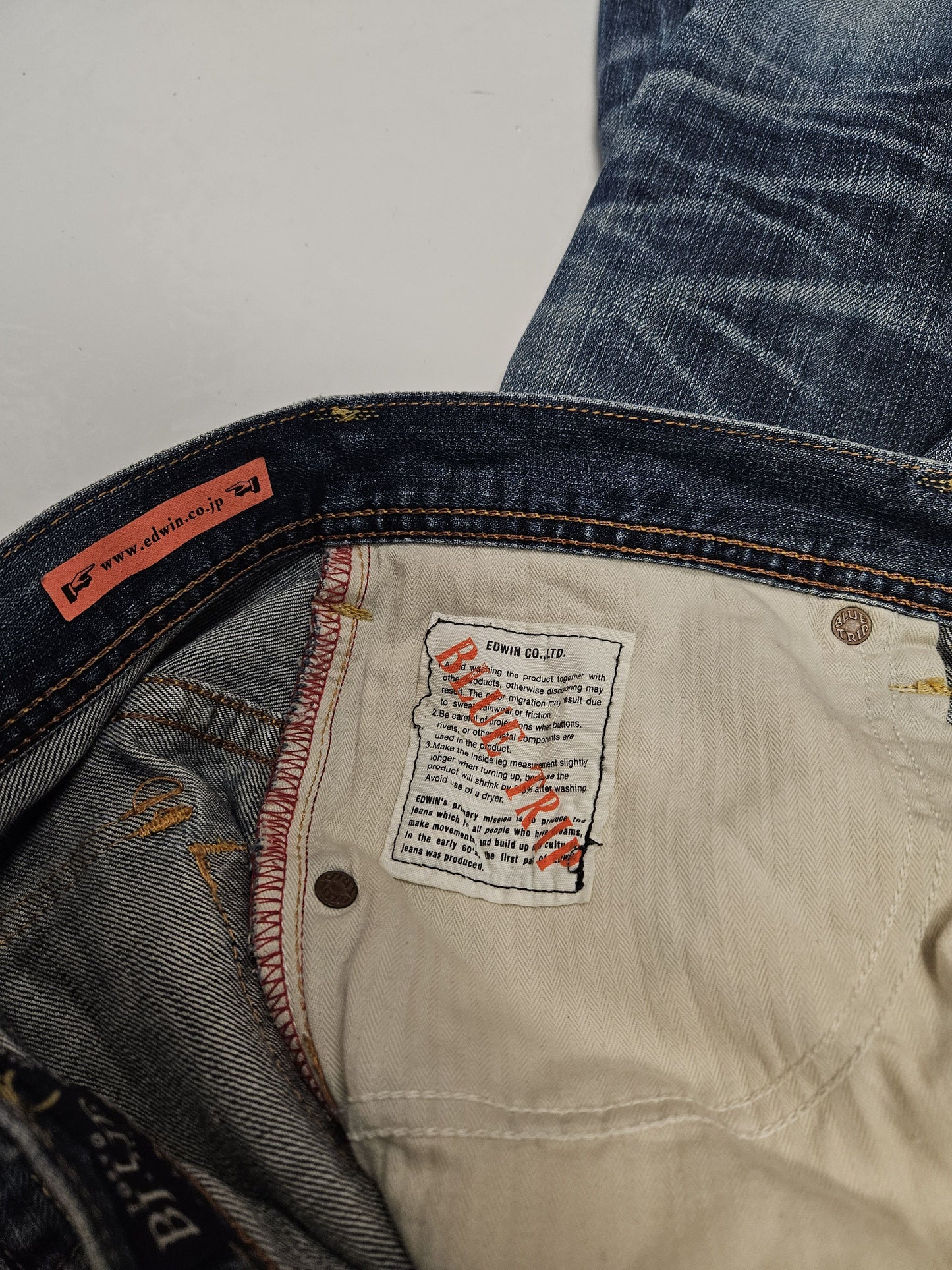Edwin blue trip distressed washed bootcut denim