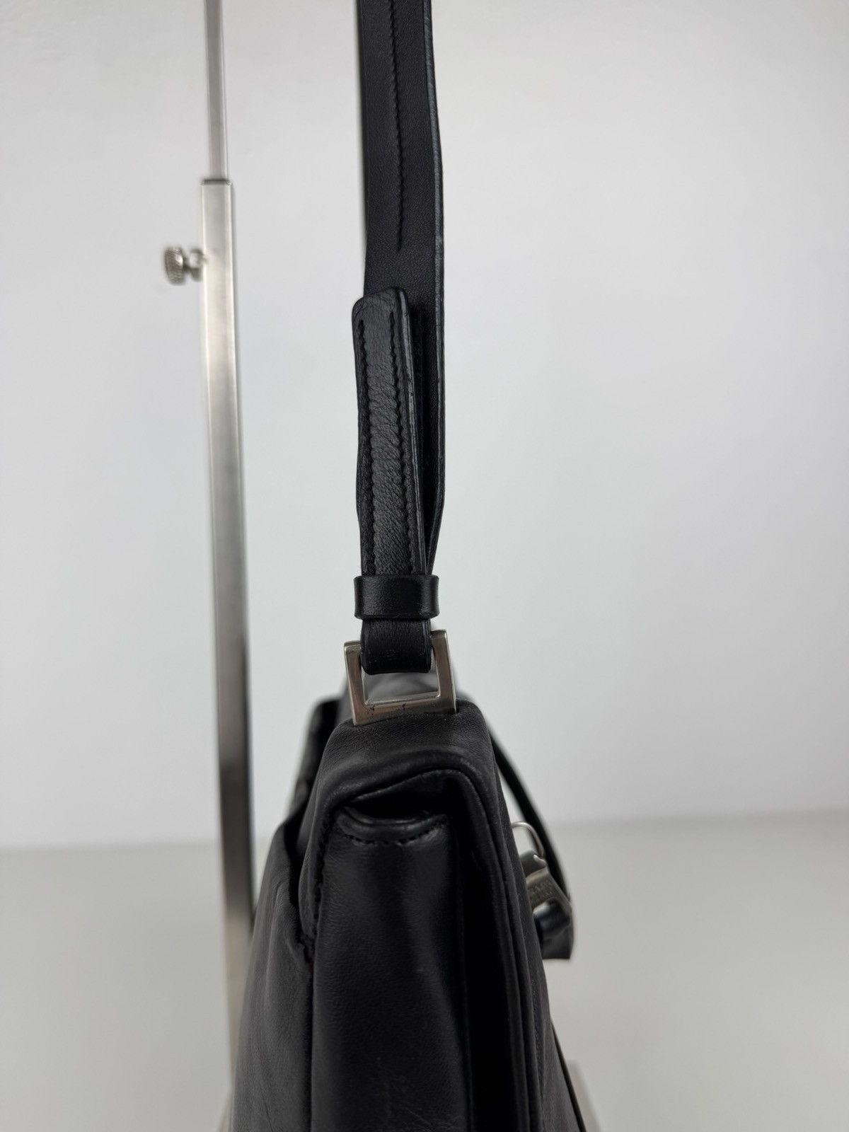 Vintage Prada embossed logo leather shoulder bag