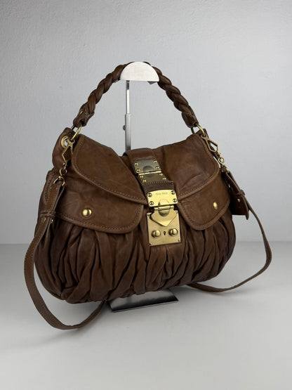 Miu Miu matelasse pleated leather coffer bag in brown