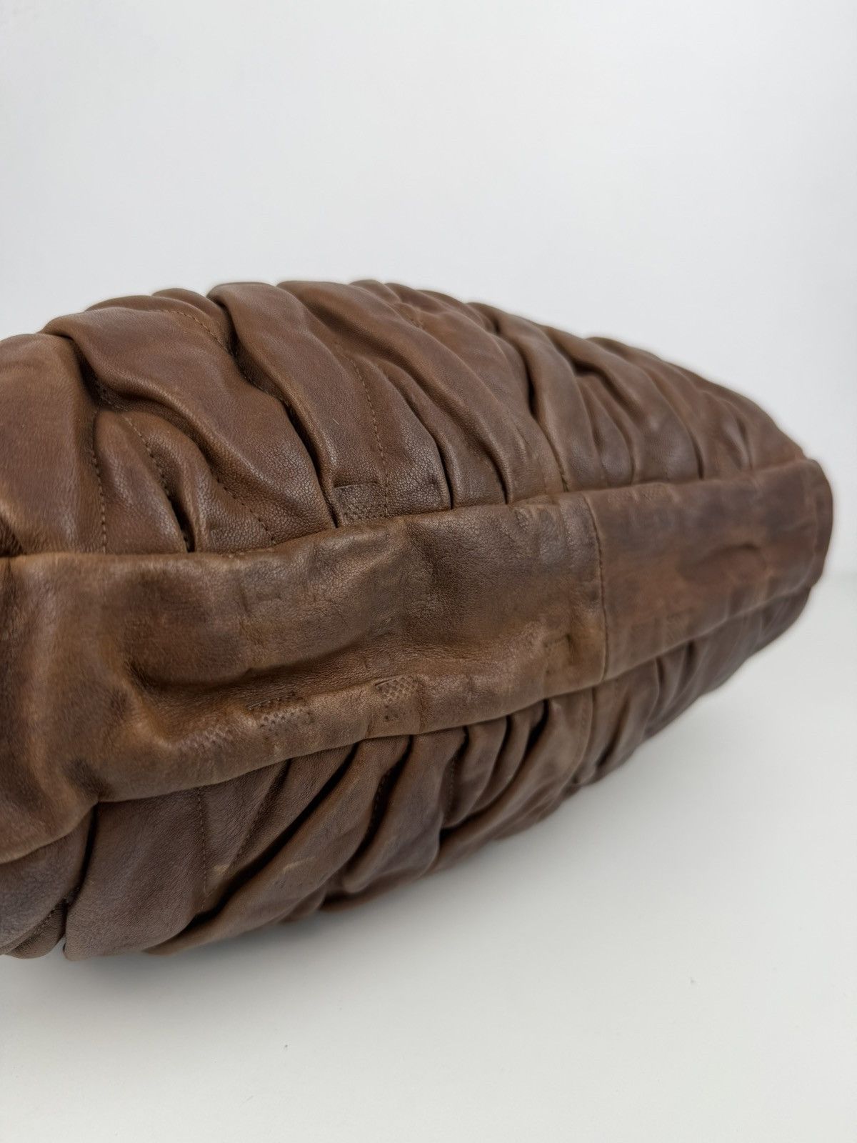 Miu Miu matelasse pleated leather coffer bag in brown