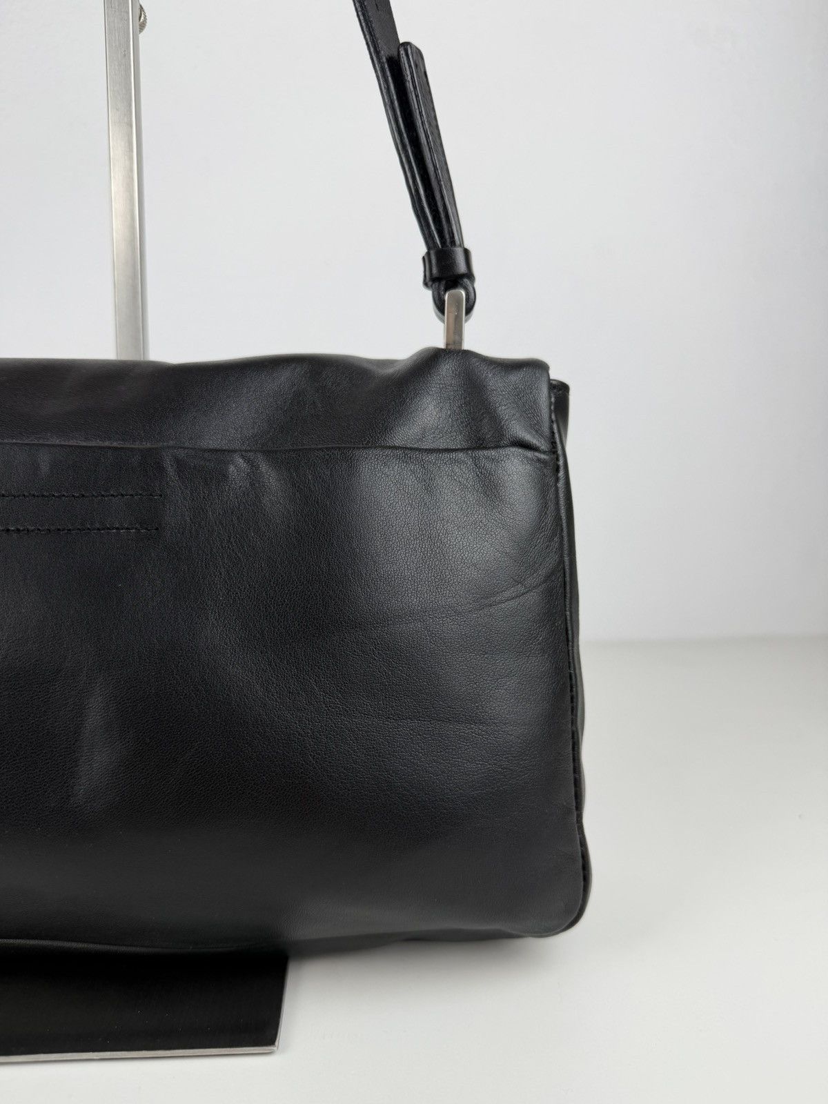 Vintage Prada embossed logo leather shoulder bag
