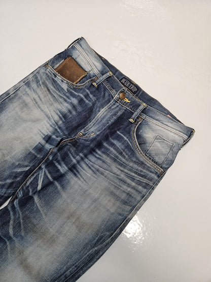 Edwin blue trip distressed washed bootcut denim