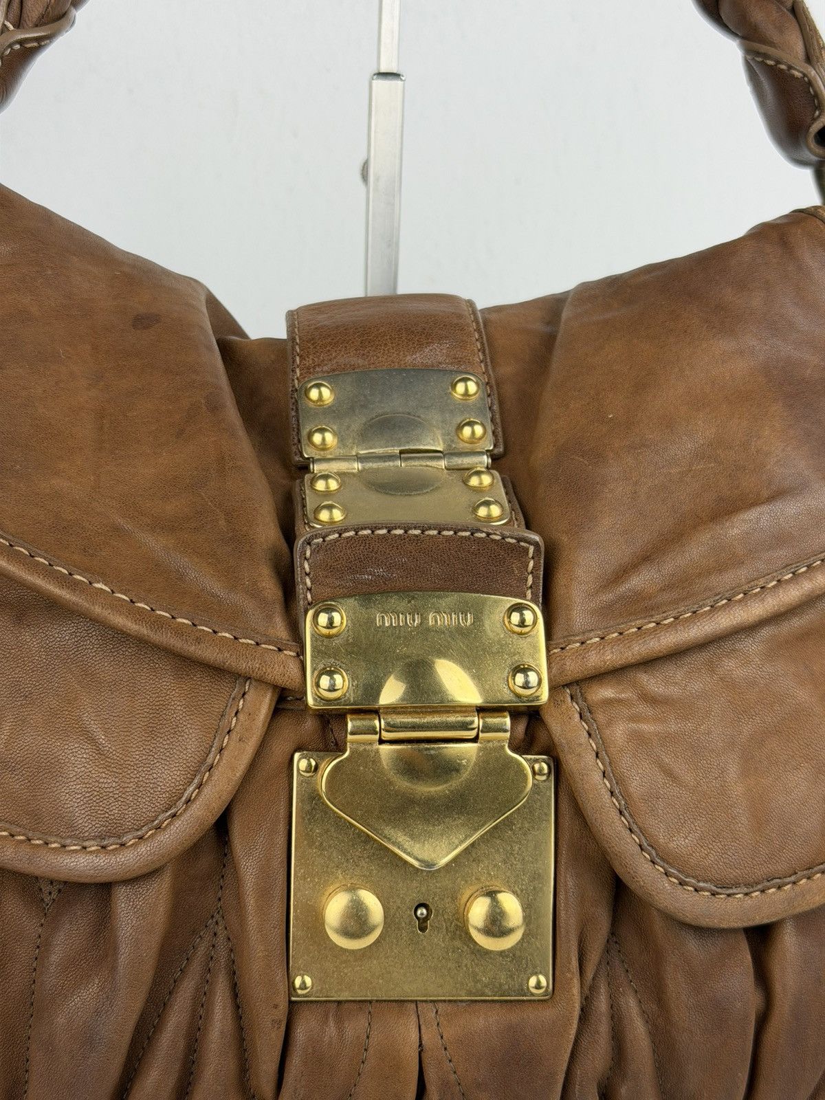 Miu Miu matelasse pleated leather coffer bag in brown