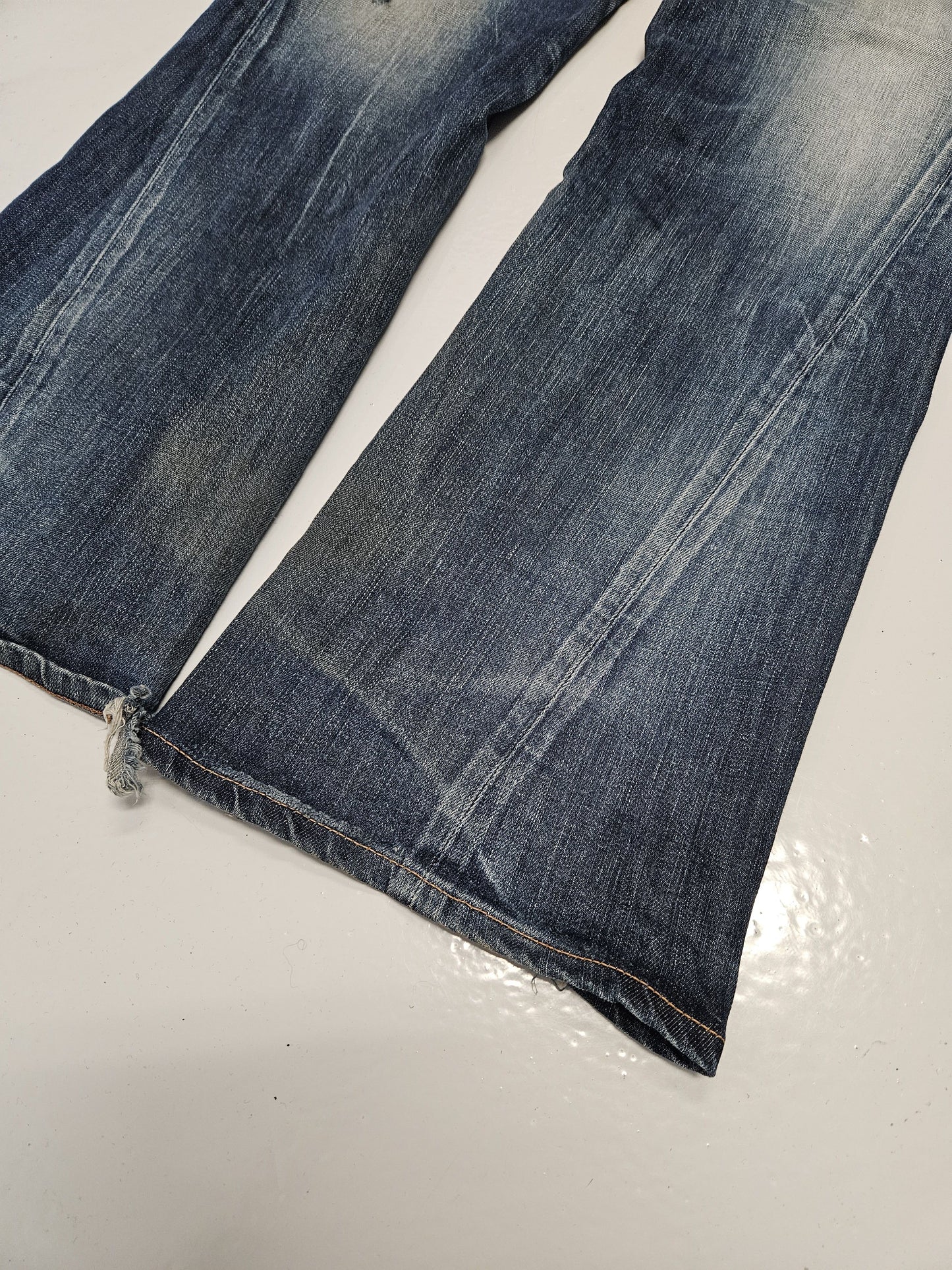 Edwin blue trip distressed washed bootcut denim