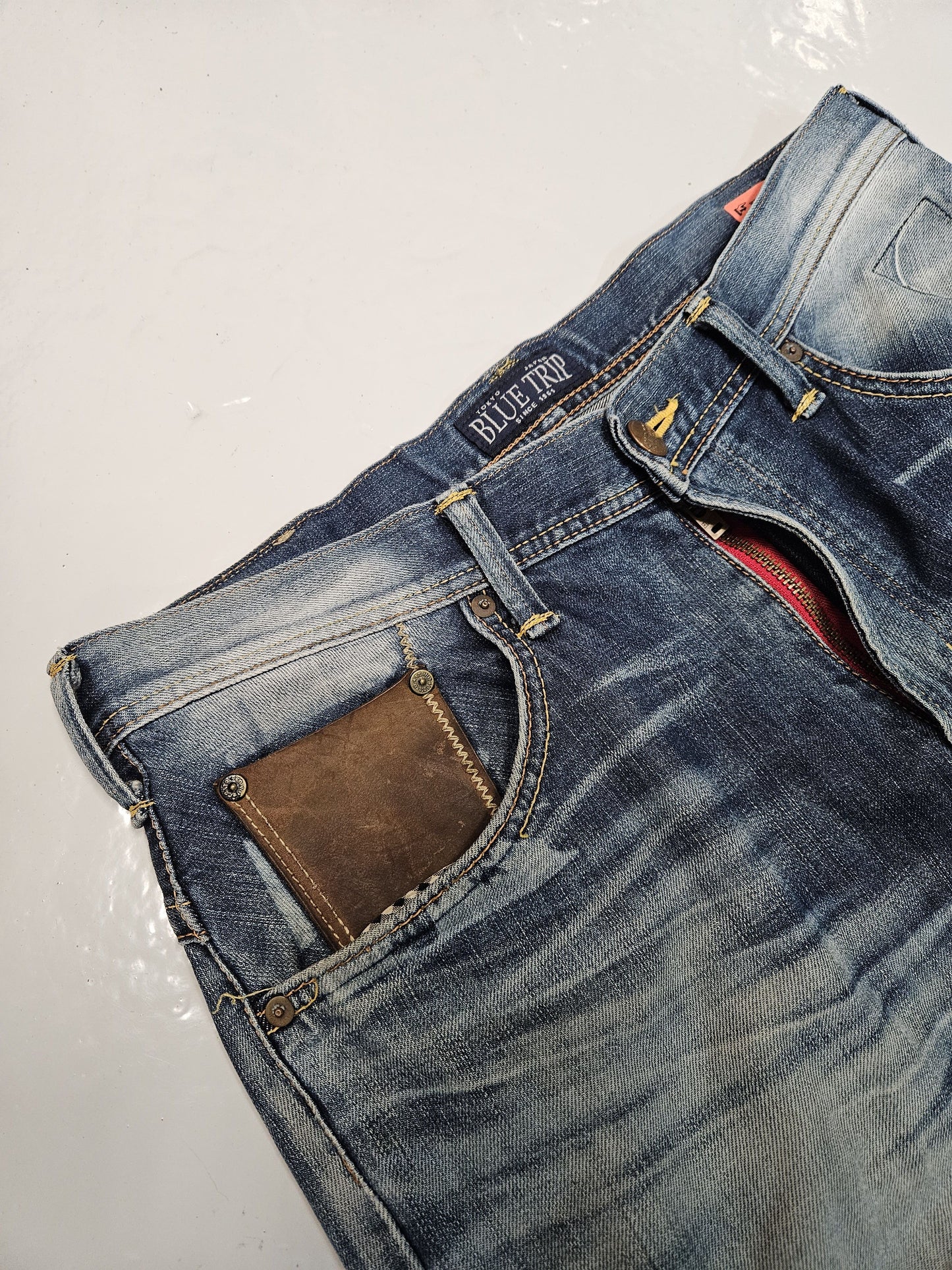 Edwin blue trip distressed washed bootcut denim