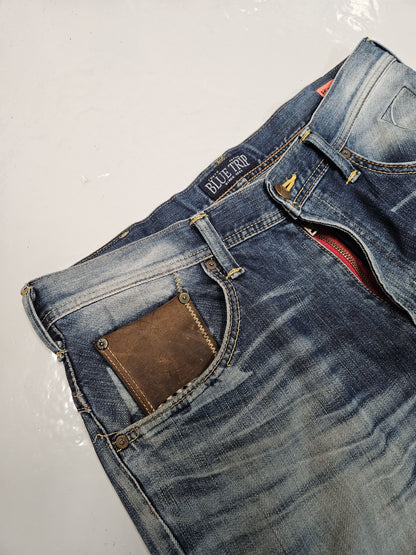 Edwin blue trip distressed washed bootcut denim