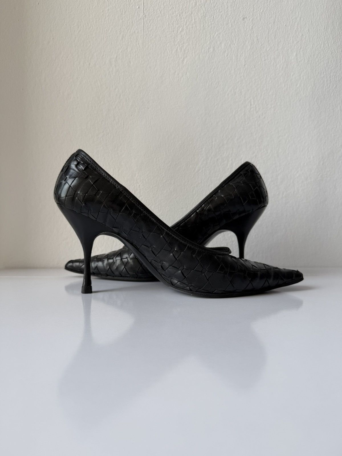 Prada woven leather long toe pumps with bow