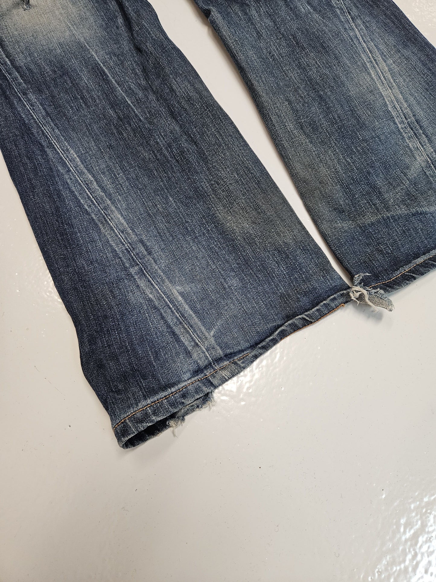 Edwin blue trip distressed washed bootcut denim