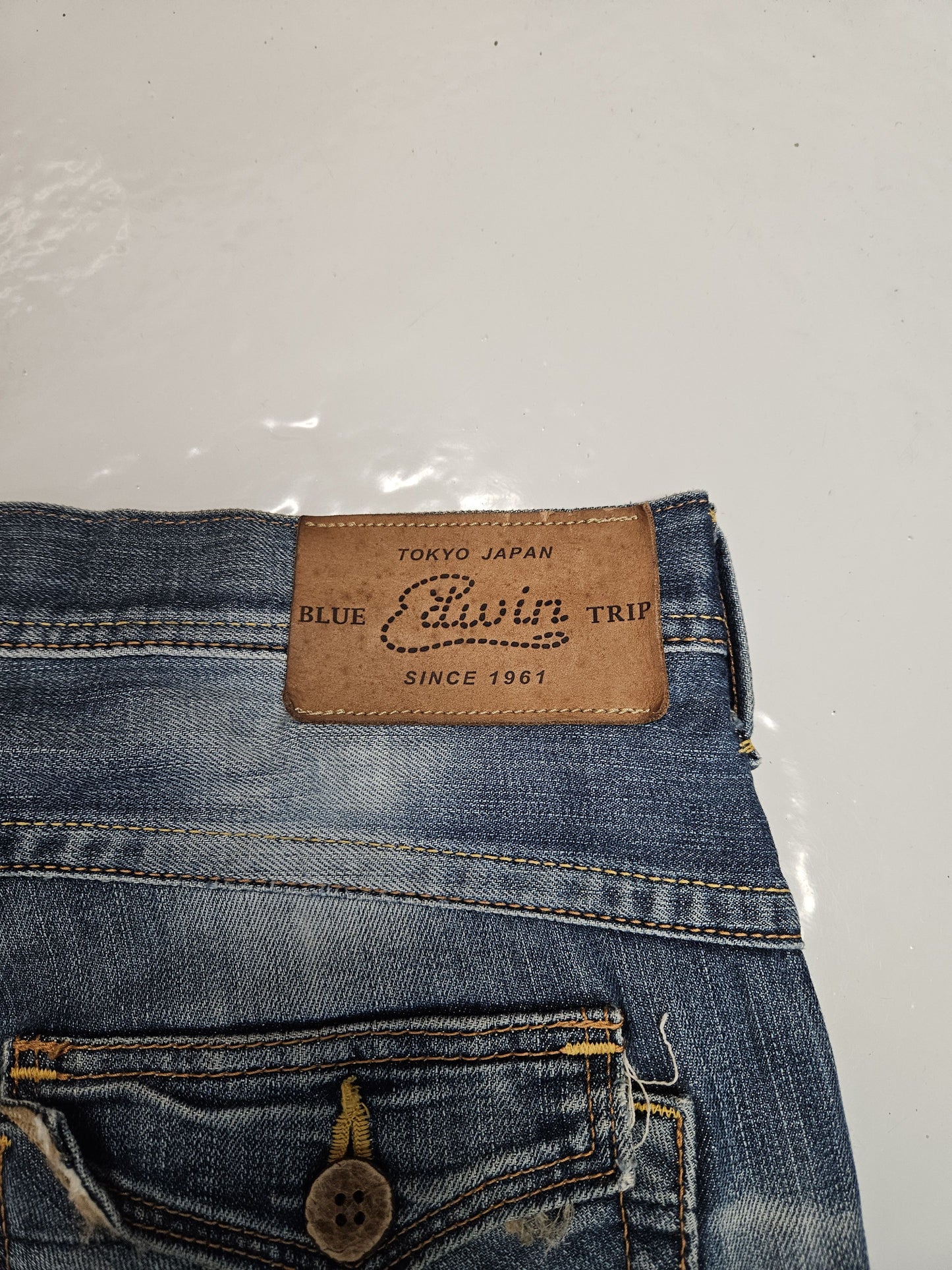 Edwin blue trip distressed washed bootcut denim