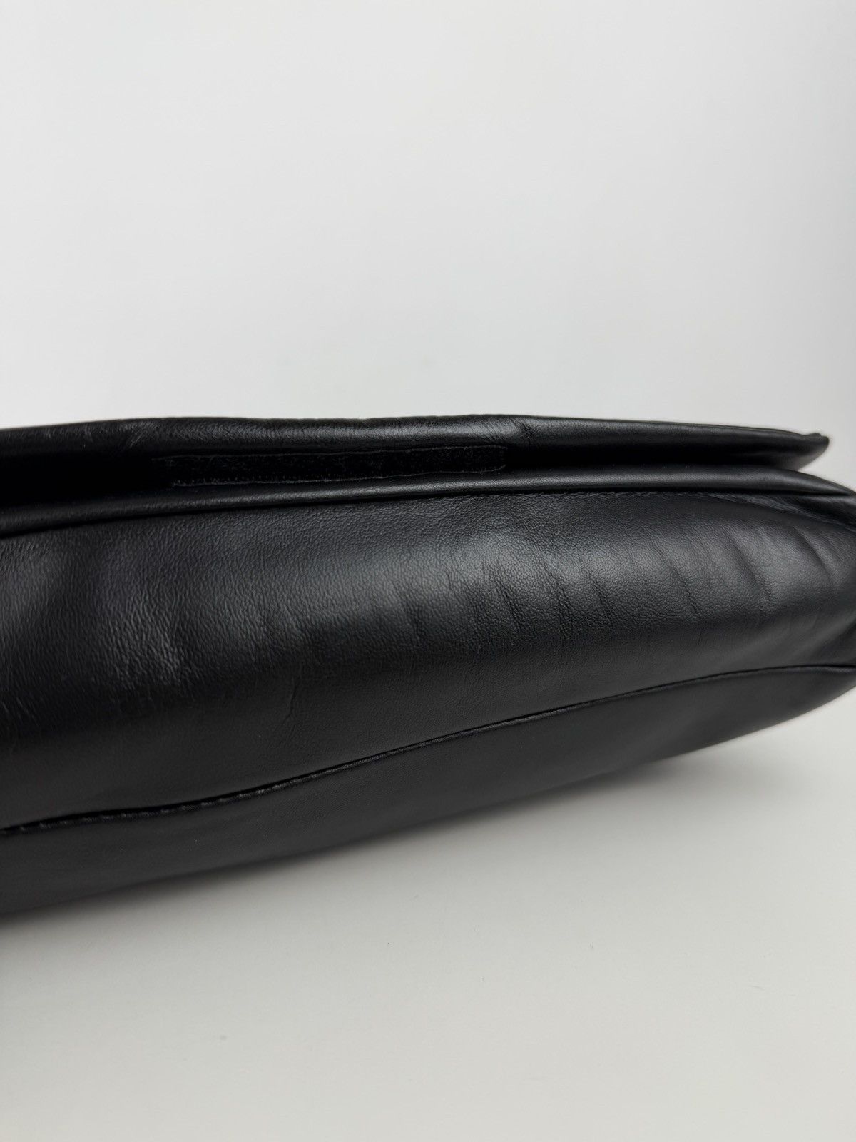 Vintage Prada embossed logo leather shoulder bag
