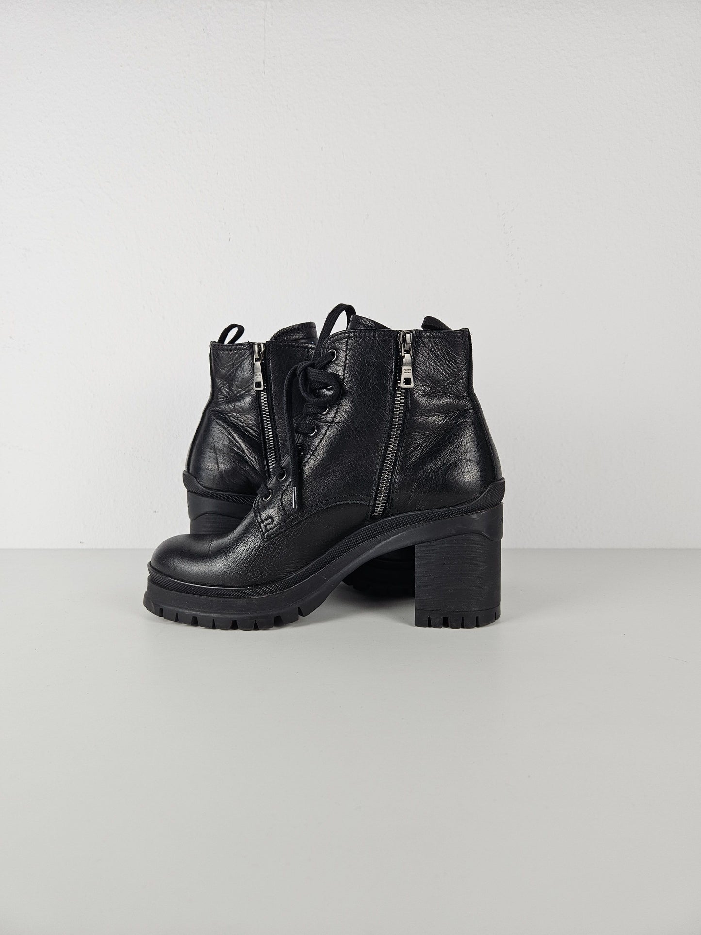 Prada lace up block heel notched sole ankle boots