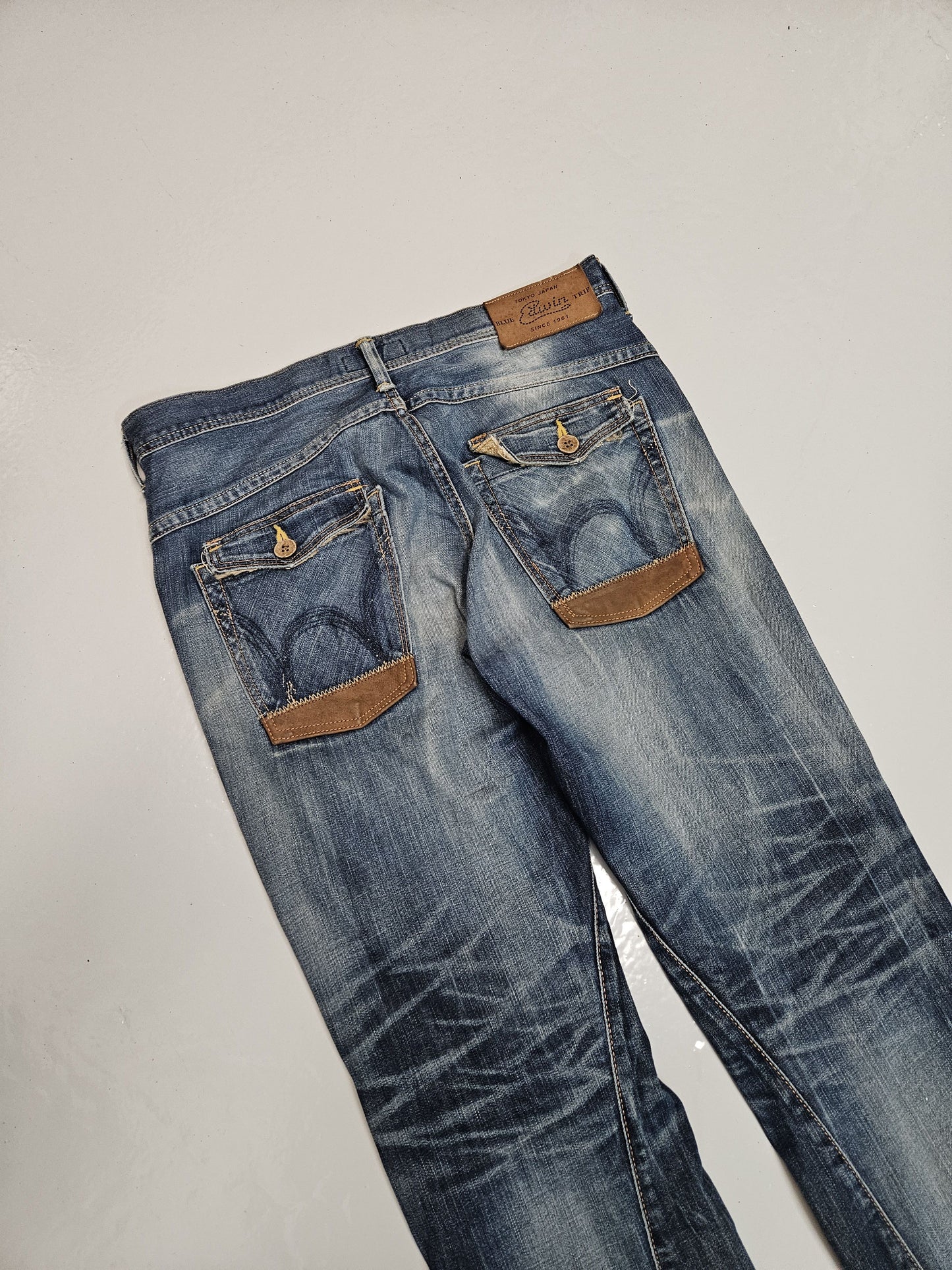 Edwin blue trip distressed washed bootcut denim