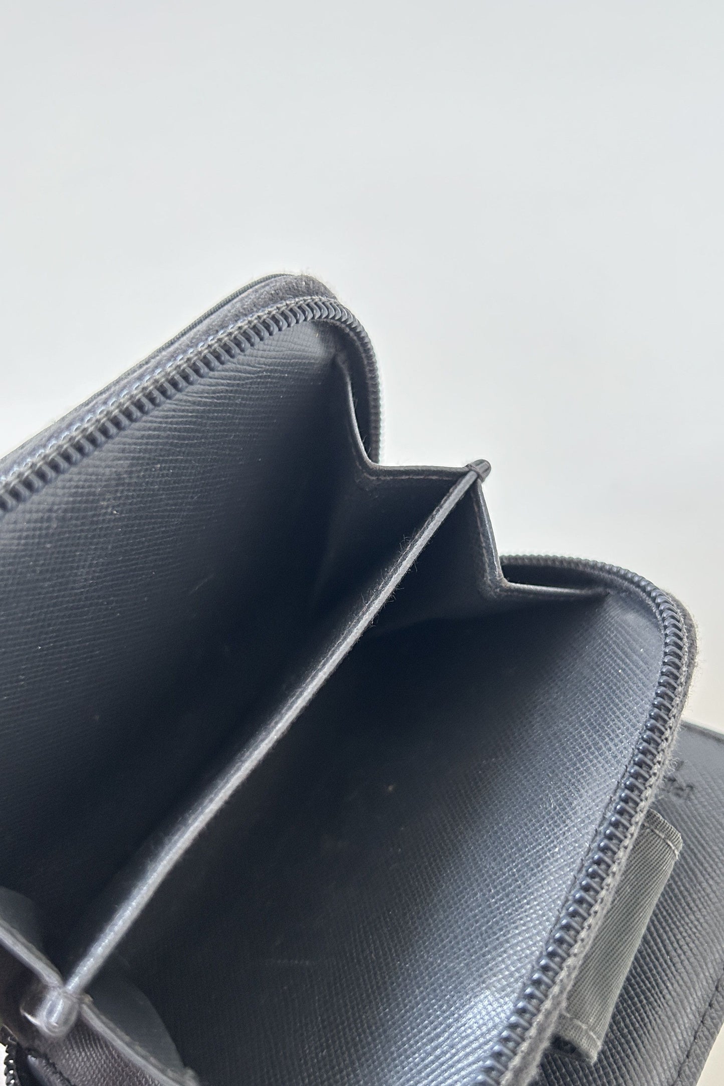 Prada nylon and saffiano leather triangle logo zip wallet