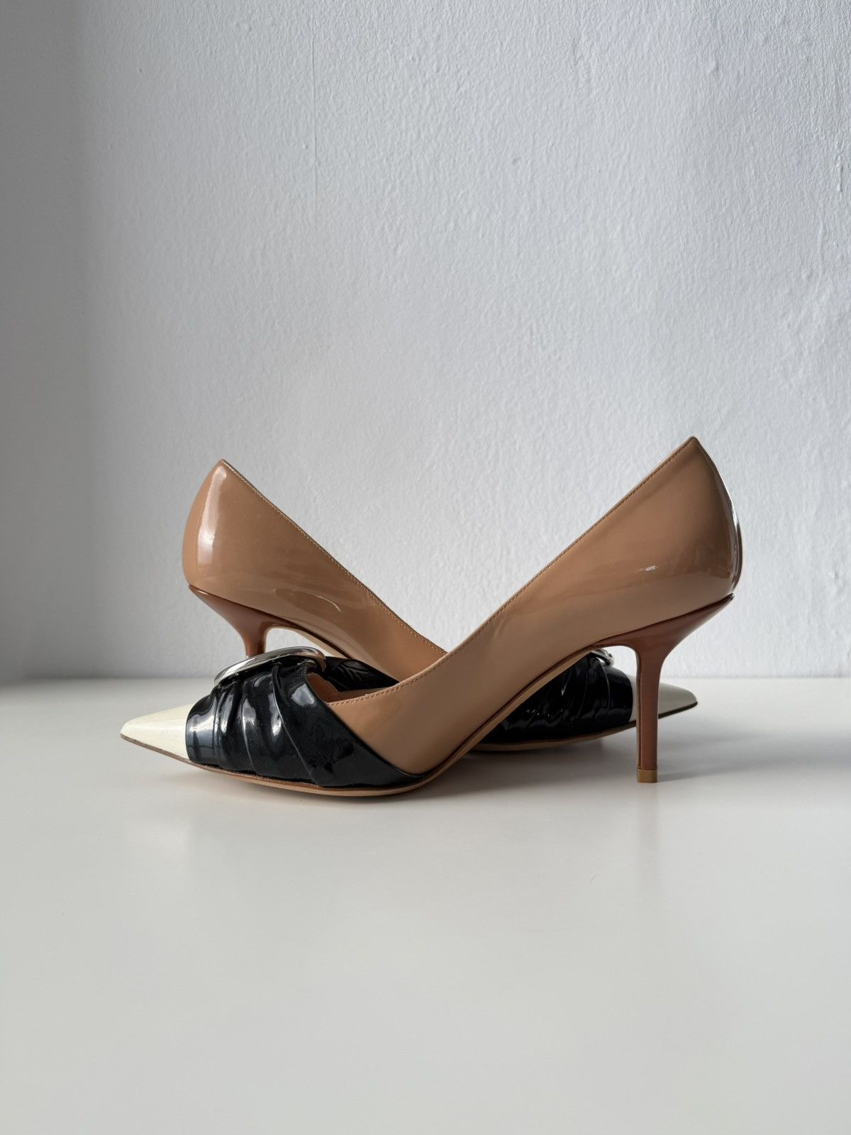 Dior patent leather buckled pointed toe pumps with bow