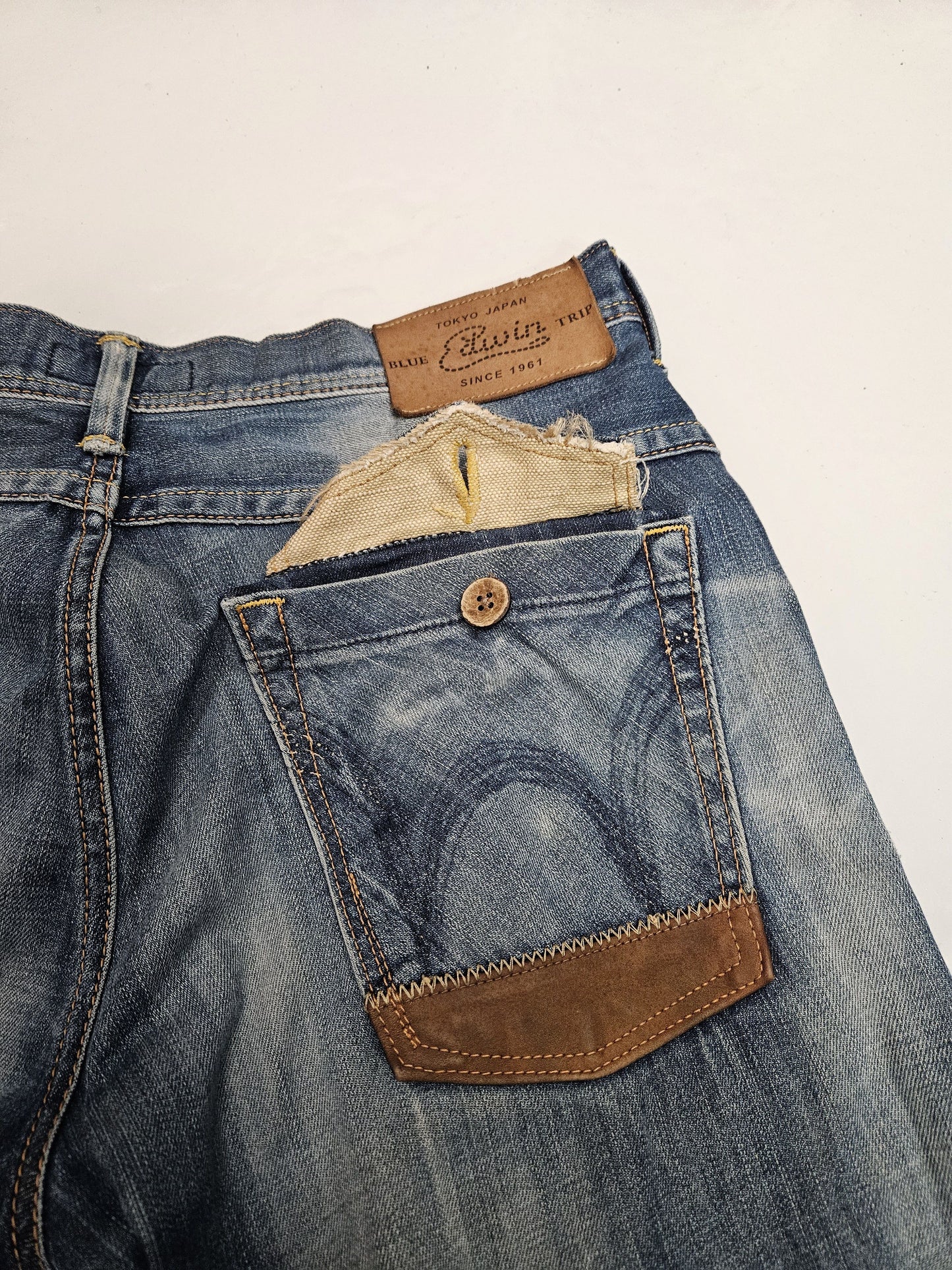 Edwin blue trip distressed washed bootcut denim