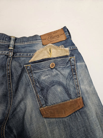 Edwin blue trip distressed washed bootcut denim