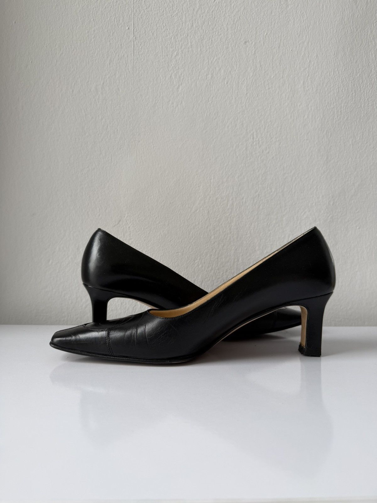 AW2001 Chanel embossed logo long toe leather pumps