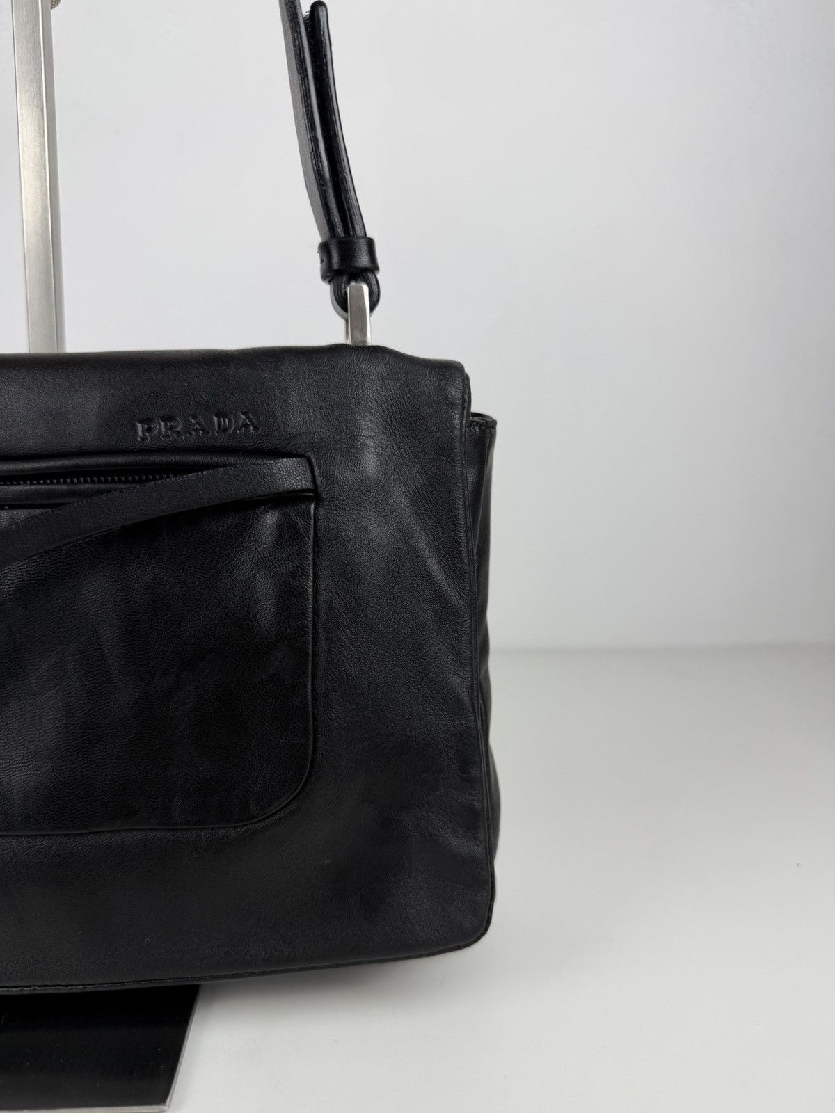 Vintage Prada embossed logo leather shoulder bag