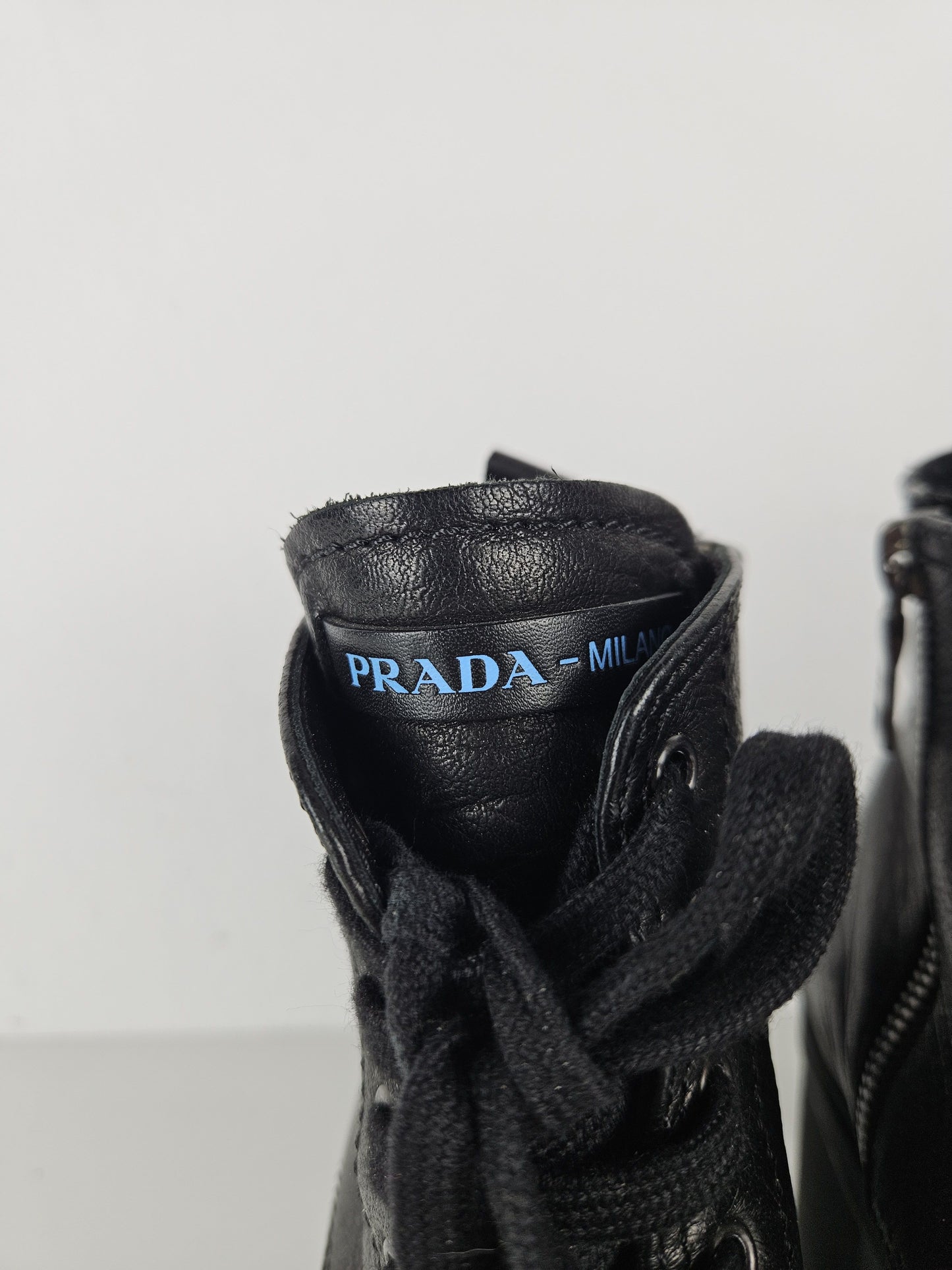 Prada lace up block heel notched sole ankle boots