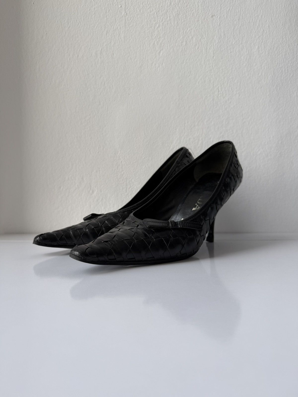 Prada woven leather long toe pumps with bow