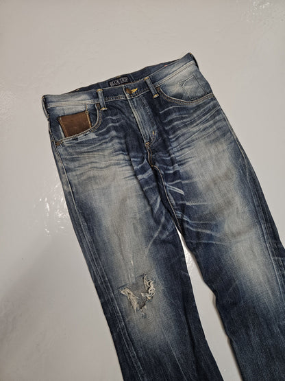 Edwin blue trip distressed washed bootcut denim