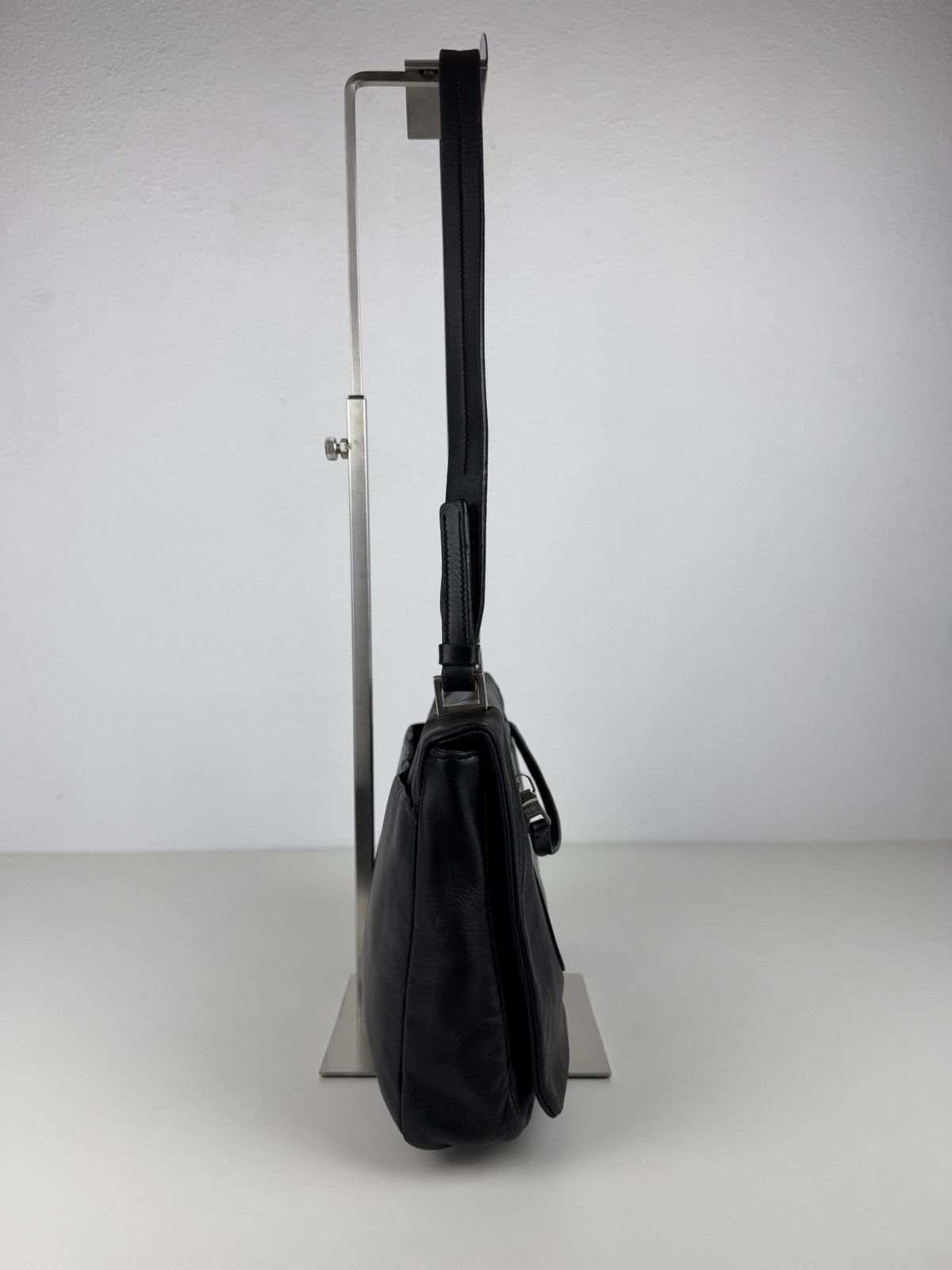 Vintage Prada embossed logo leather shoulder bag