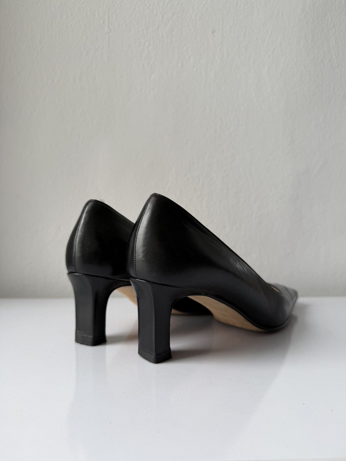 AW2001 Chanel embossed logo long toe leather pumps