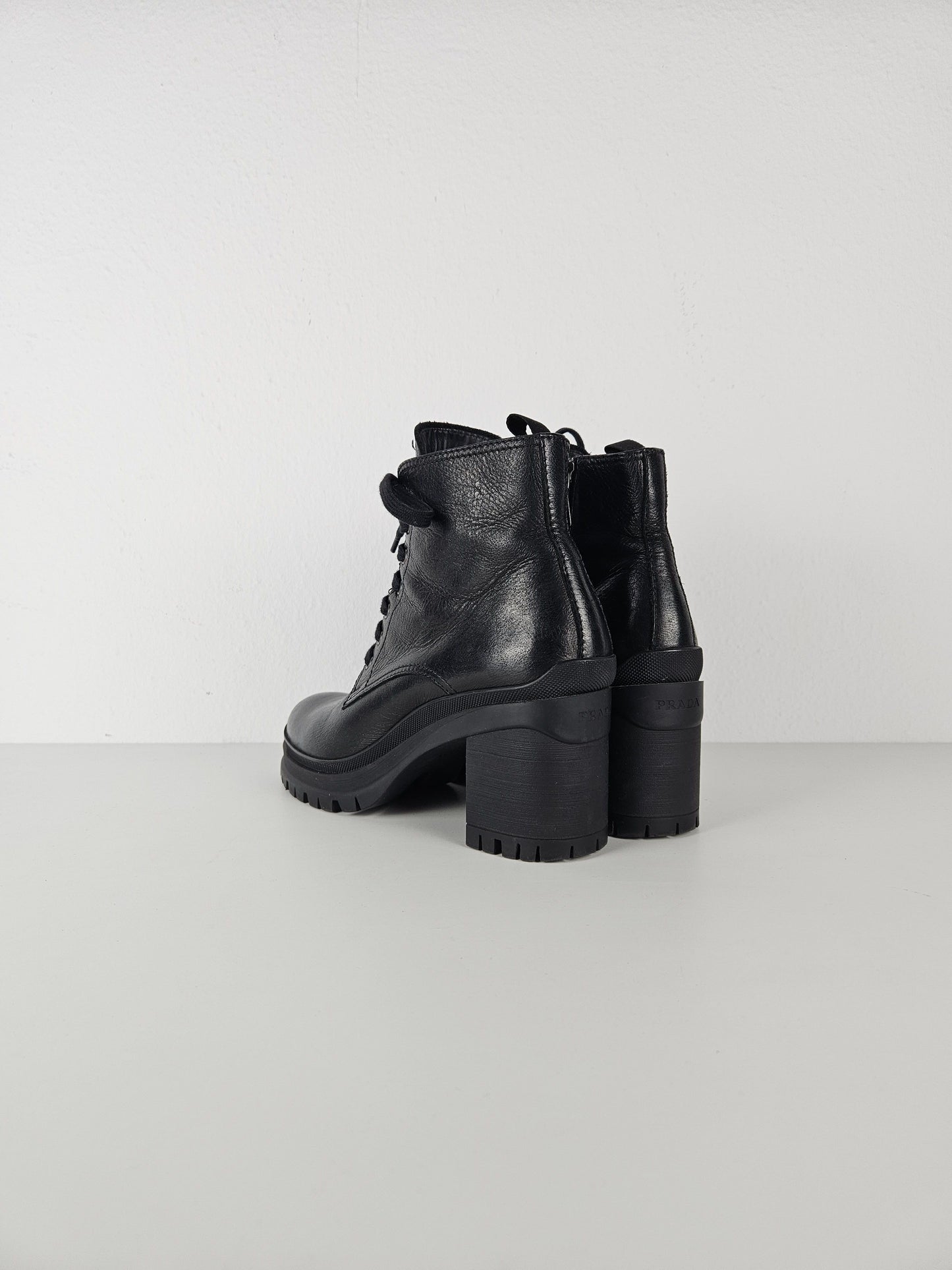Prada lace up block heel notched sole ankle boots
