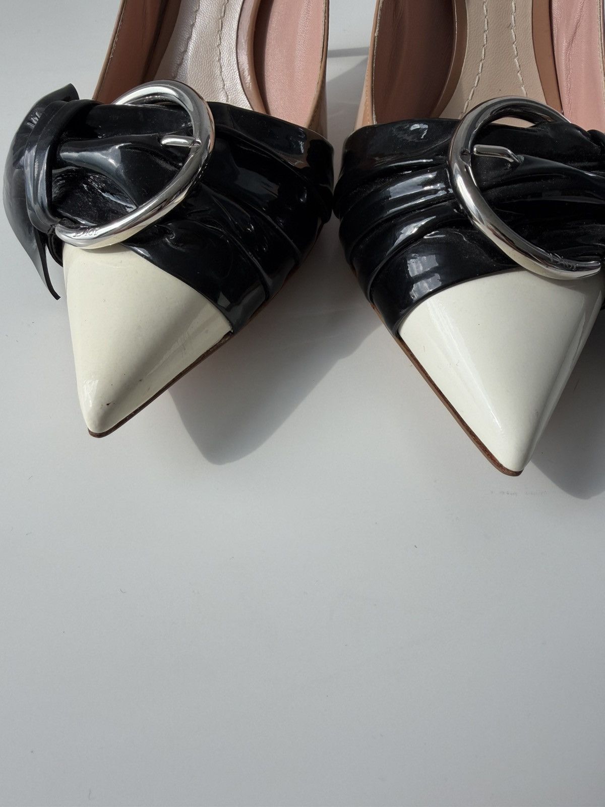 Dior patent leather buckled pointed toe pumps with bow