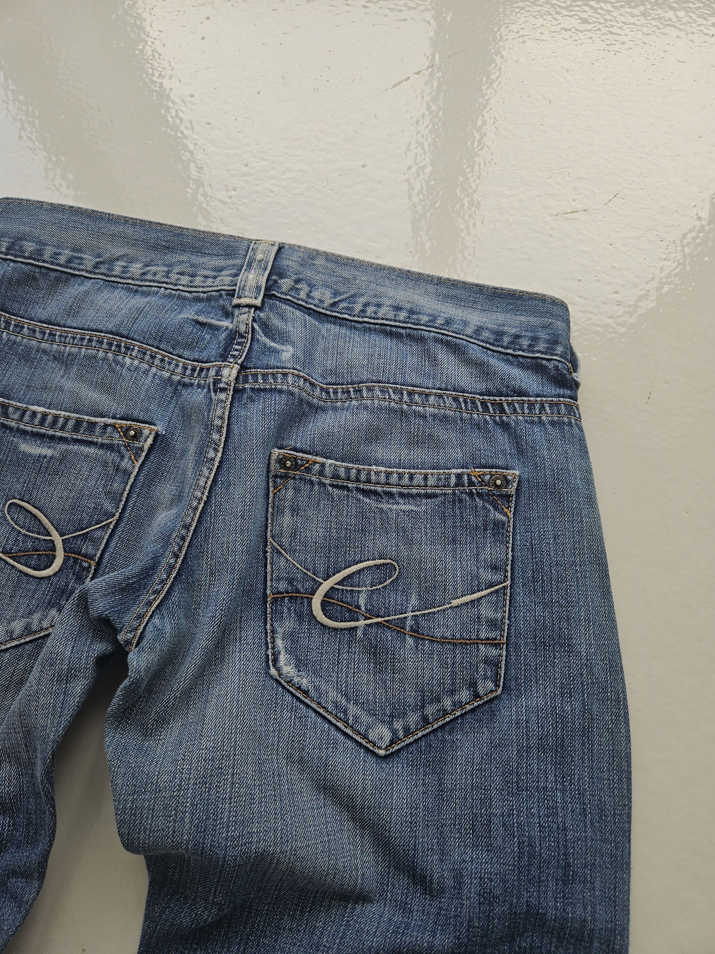 Vintage distressed bootcut low waisted denim