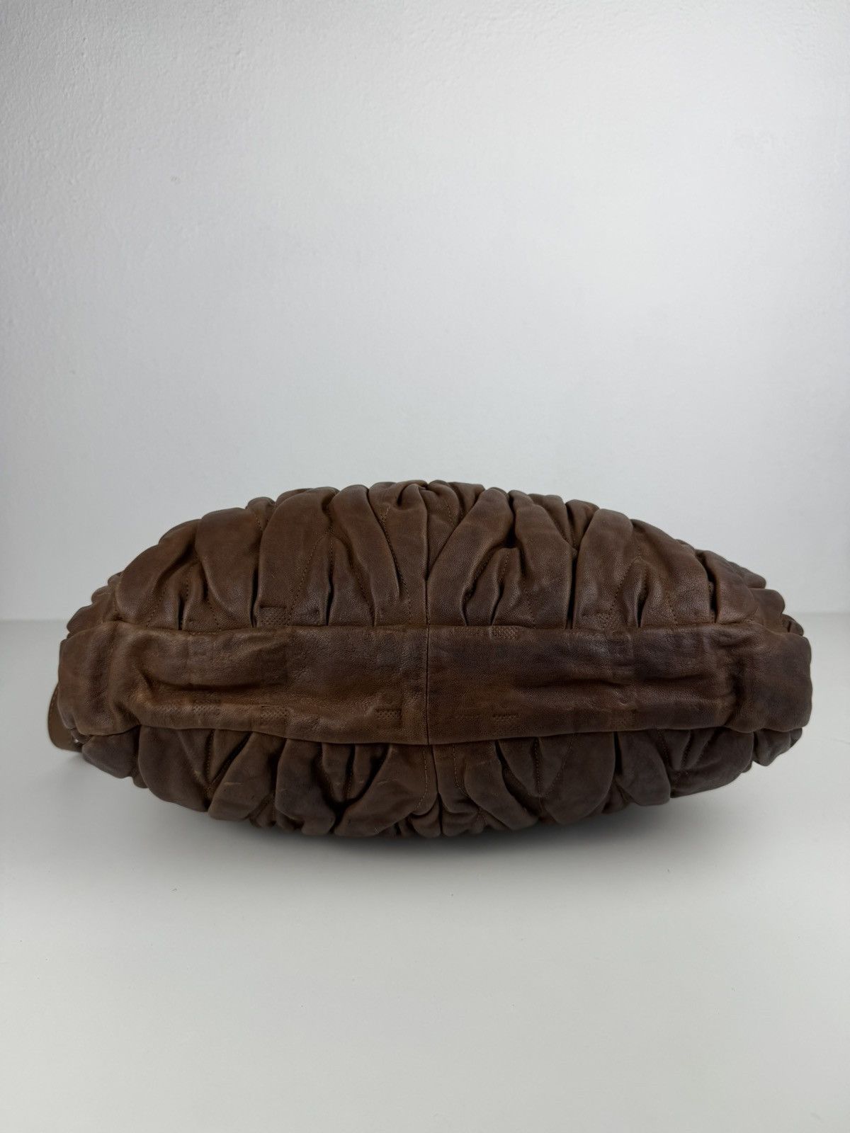 Miu Miu matelasse pleated leather coffer bag in brown